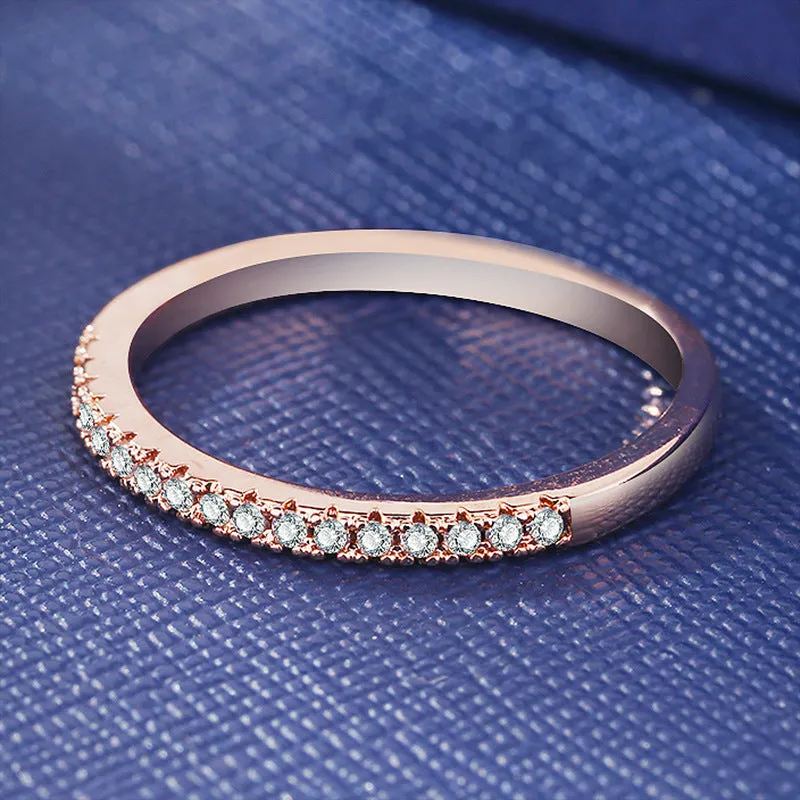 Women's crystal band ring in rose gold finish with cubic zirconia stones, US size 7