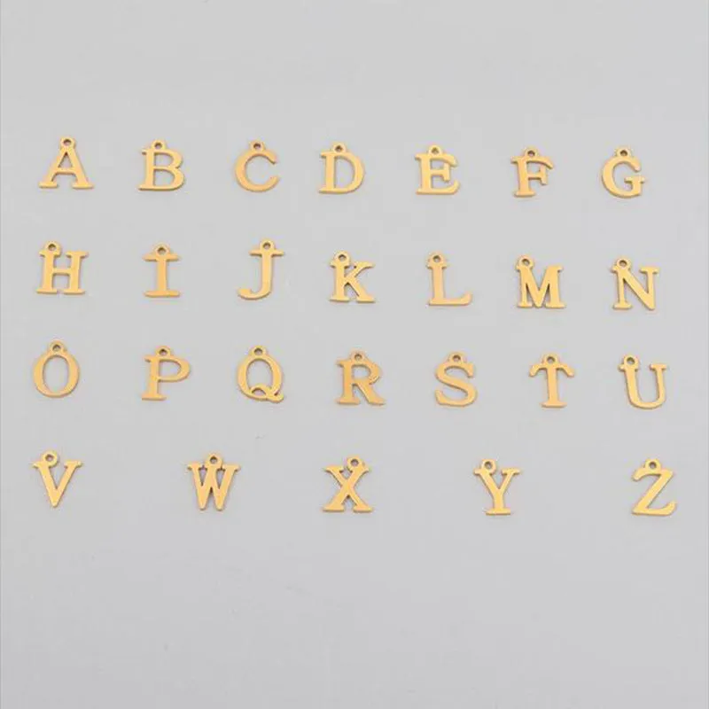 Stainless steel clip chain necklace with raised letter A pendant and imitation pearl in gold colour on a white background