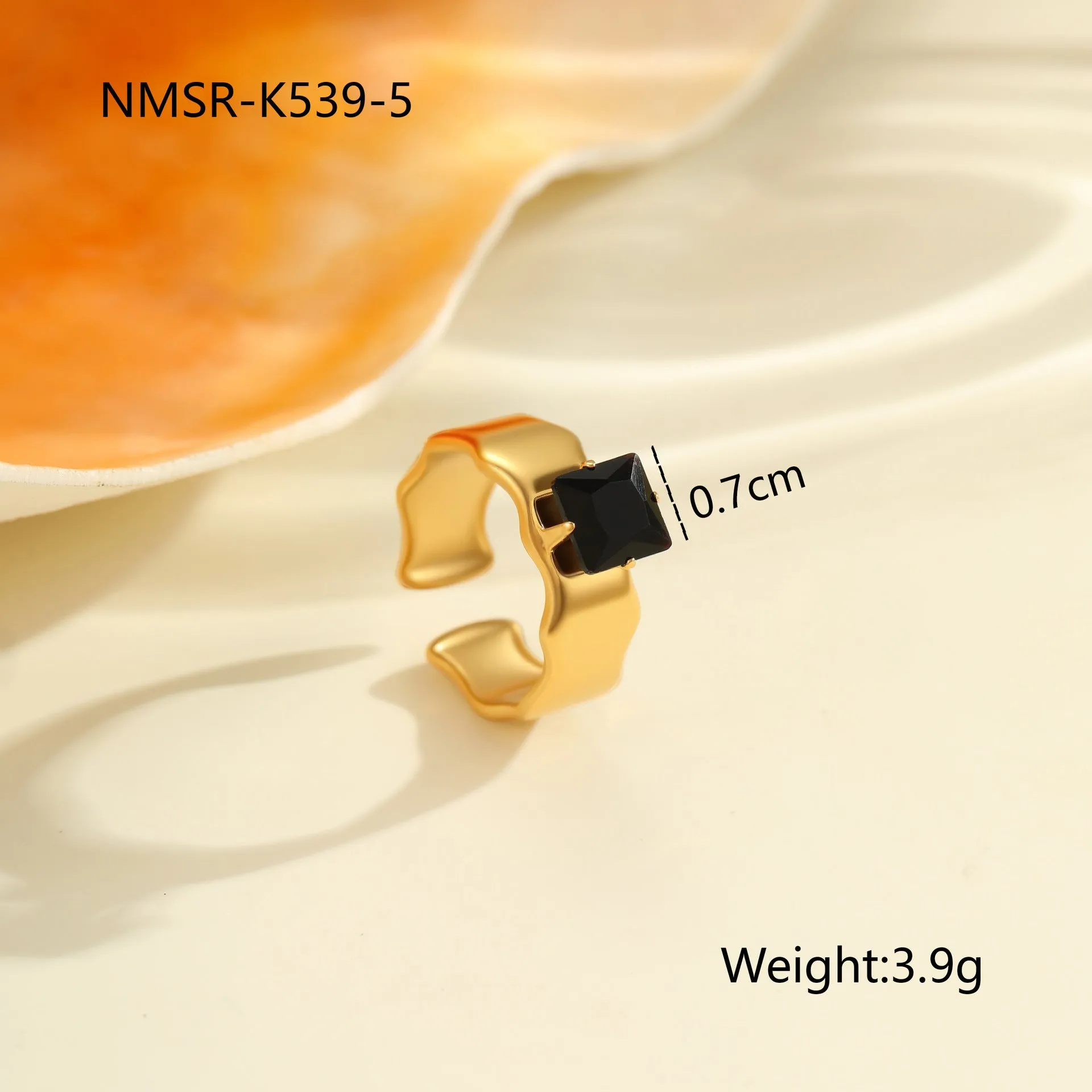 Geometric open mouth titanium steel ring for women with zircon inlays on a grey background