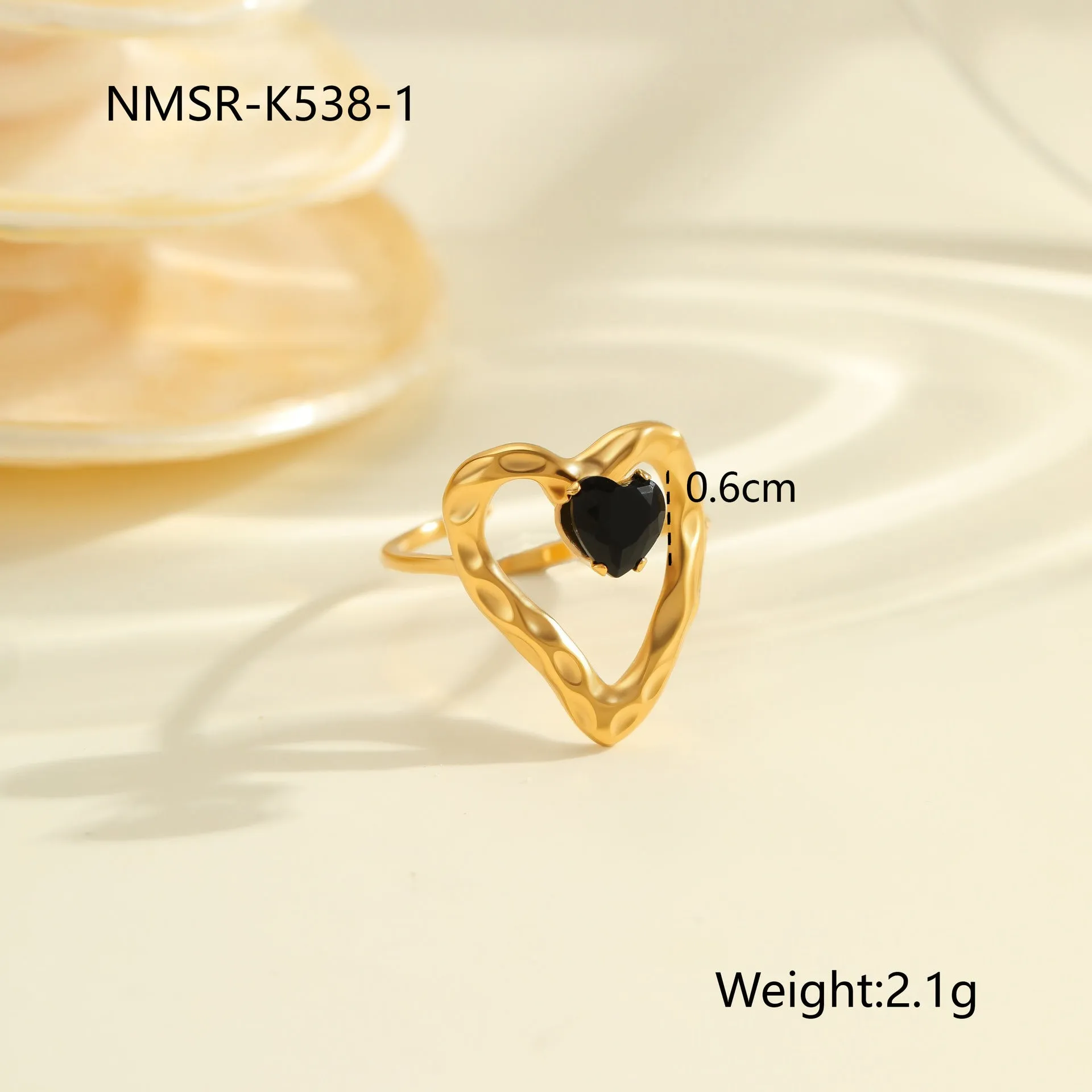 Geometric open mouth titanium steel ring for women with zircon inlays on a grey background