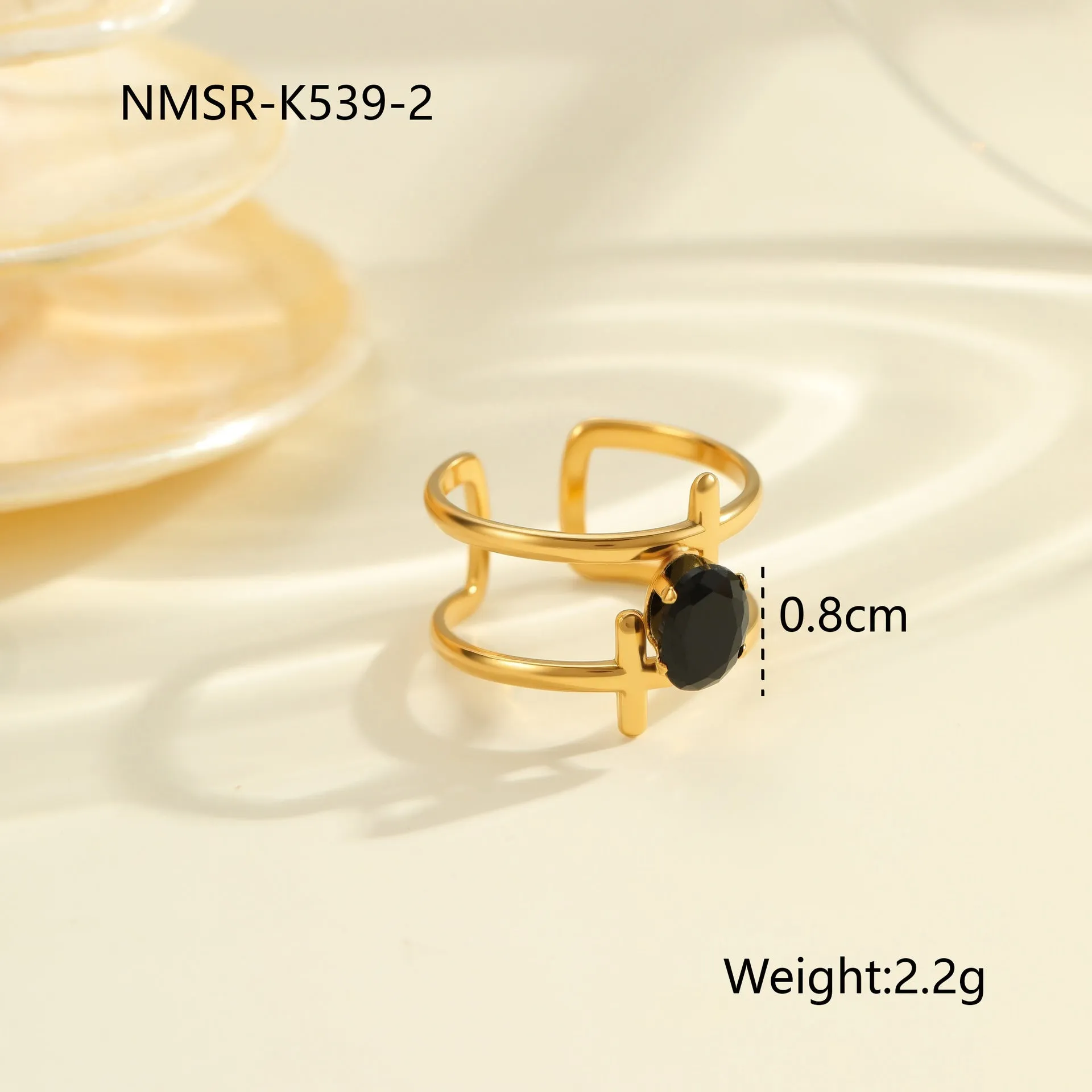 Geometric open mouth titanium steel ring for women with zircon inlays on a grey background