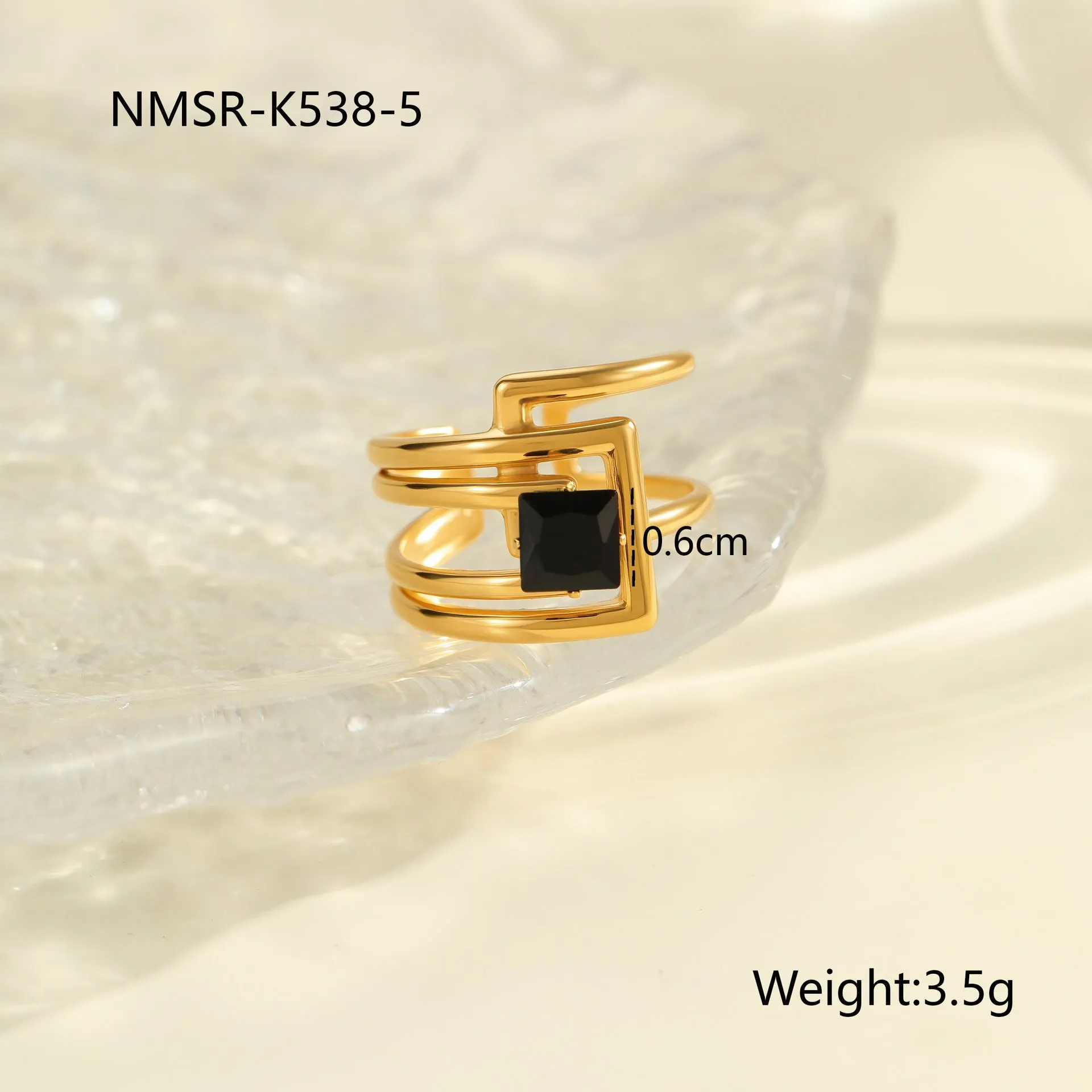 Geometric open mouth titanium steel ring for women with zircon inlays on a grey background