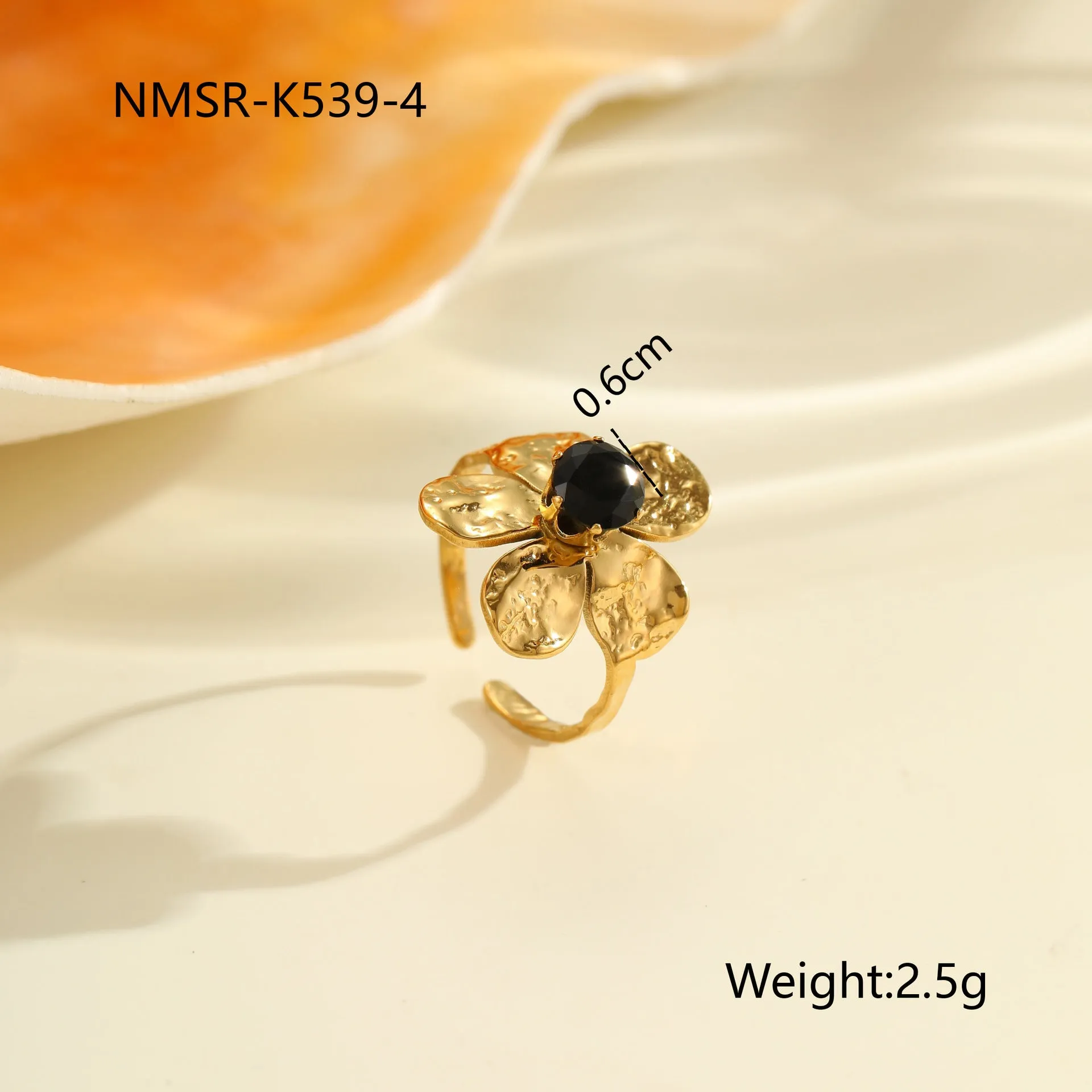 Geometric open mouth titanium steel ring for women with zircon inlays on a grey background