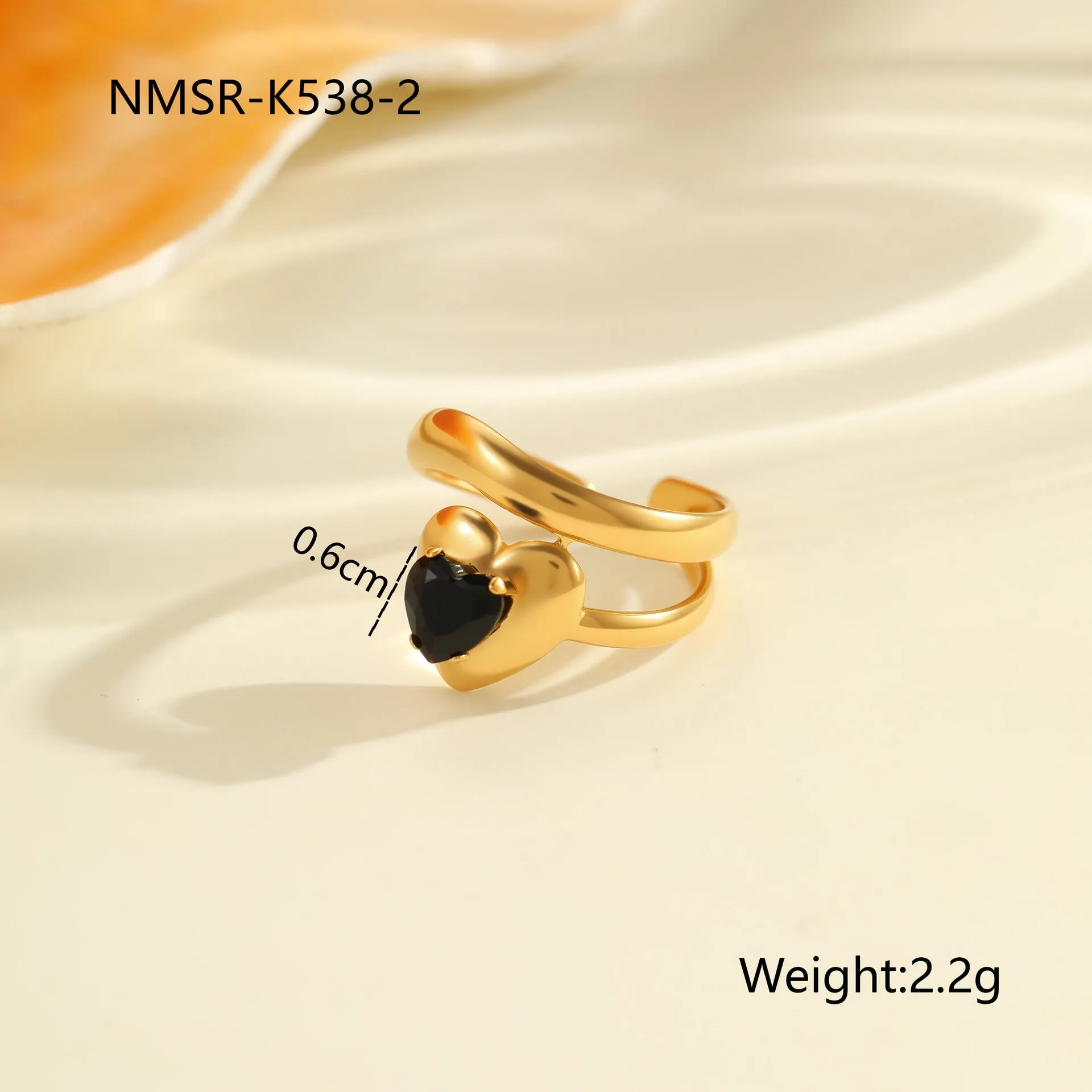 Geometric open mouth titanium steel ring for women with zircon inlays on a grey background