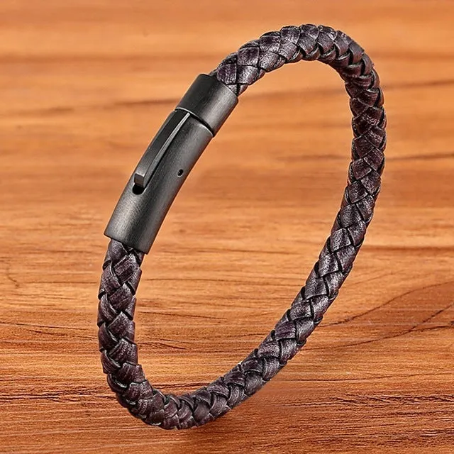 Black stainless steel bracelet with natural zircon stone on neutral background