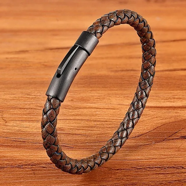 Black stainless steel bracelet with natural zircon stone on neutral background