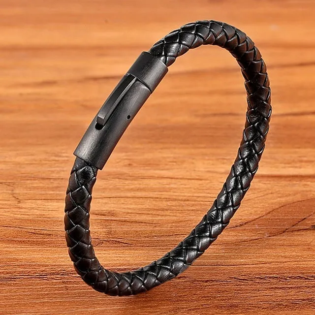 Black stainless steel bracelet with natural zircon stone on neutral background