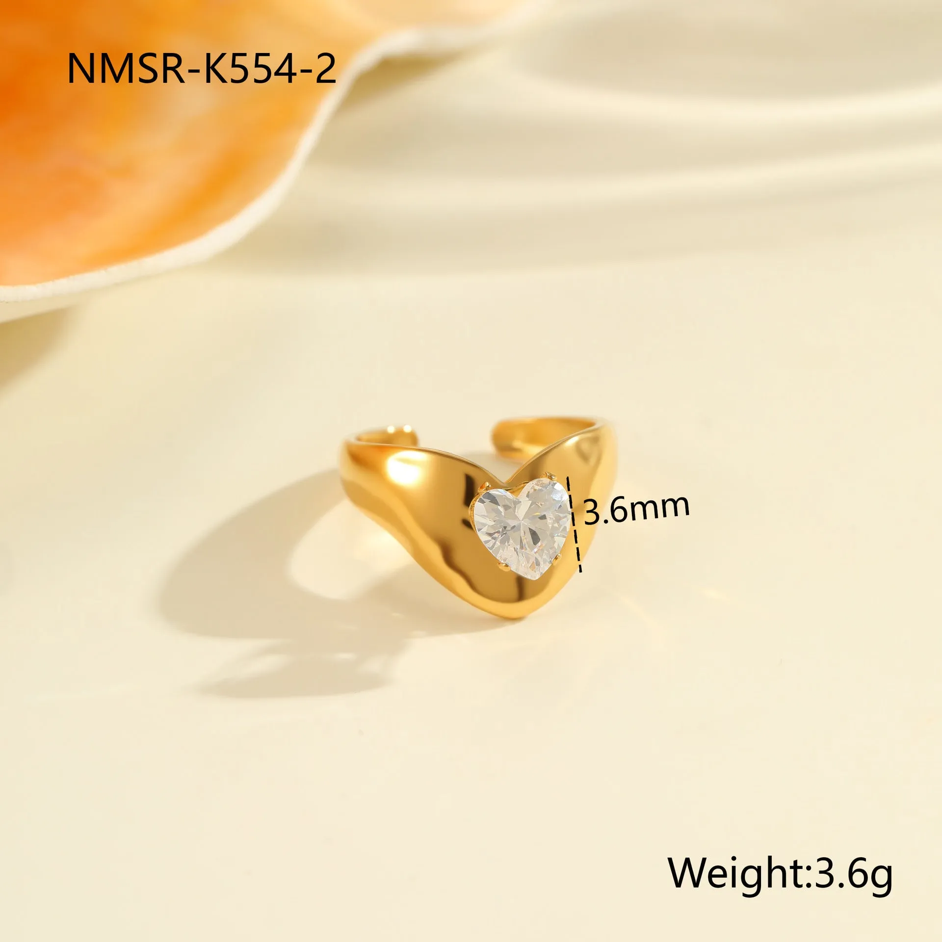 Geometric open mouth zircon ring in stainless steel with electroplated colour finish.