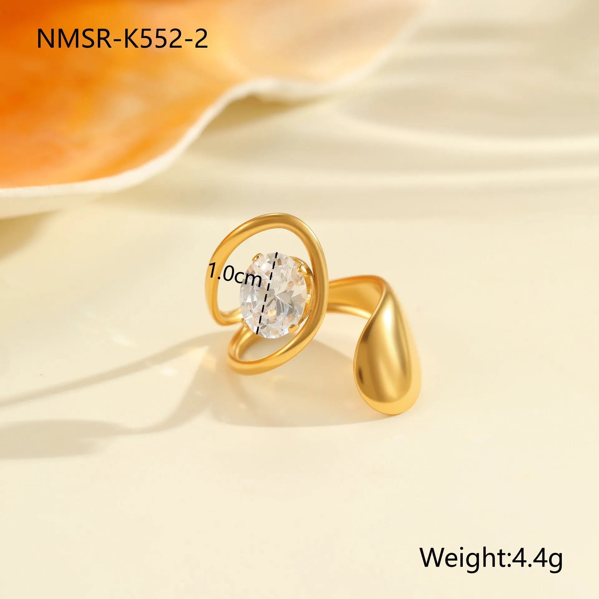 Geometric open mouth zircon ring in stainless steel with electroplated colour finish.