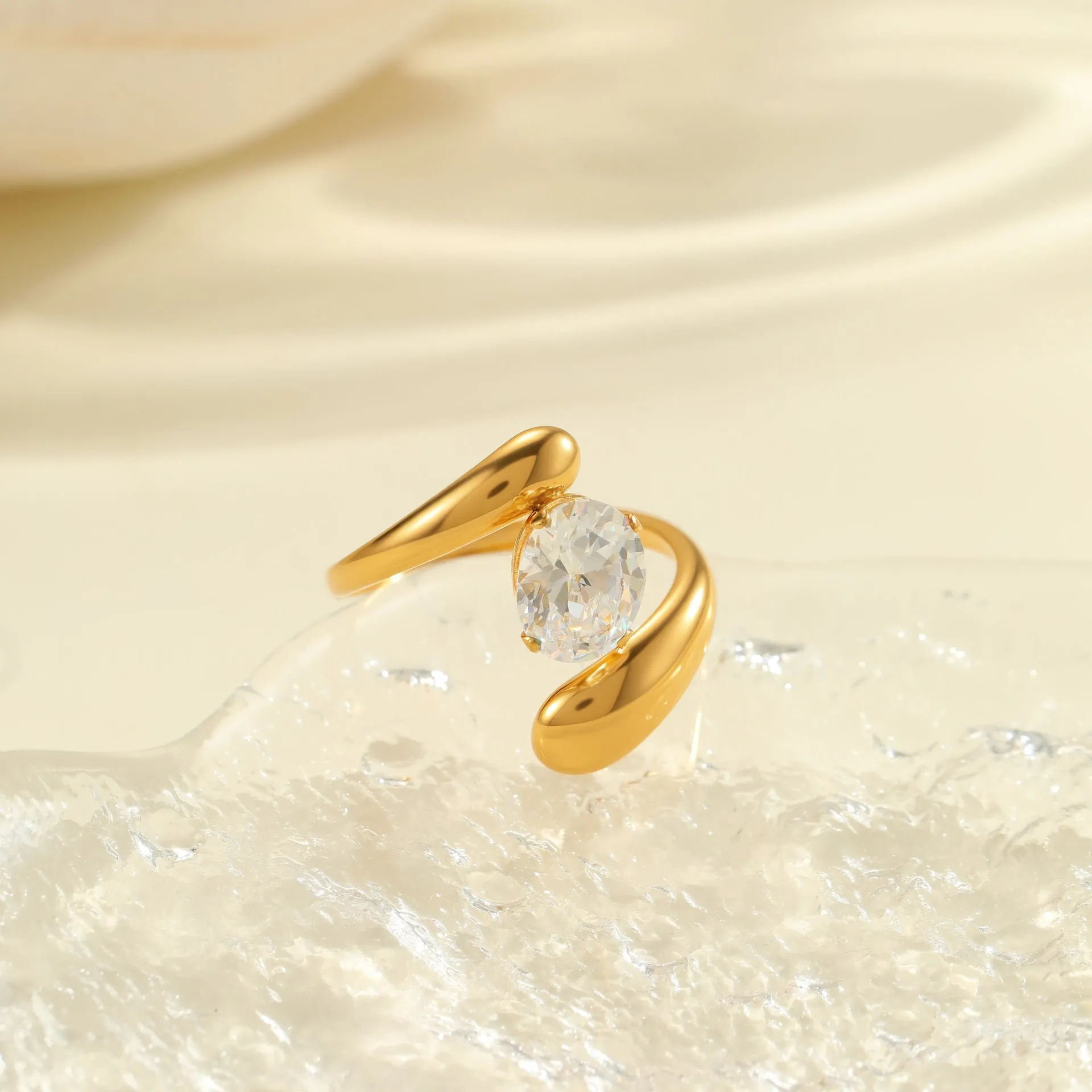 Geometric open mouth zircon ring in stainless steel with electroplated colour finish.