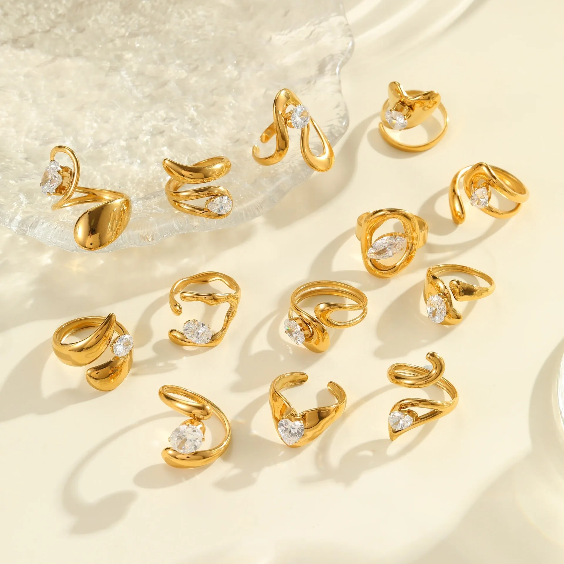 Geometric open mouth zircon ring in stainless steel with electroplated colour finish.