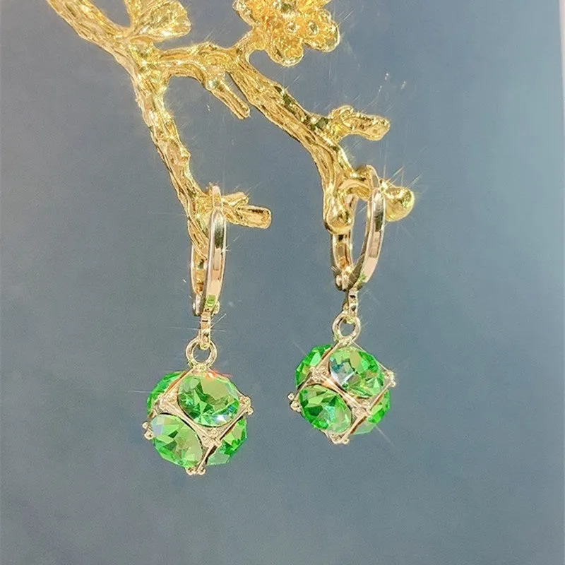 Geometric rose design women's electroplated copper earrings shown in one of the available colour variants.