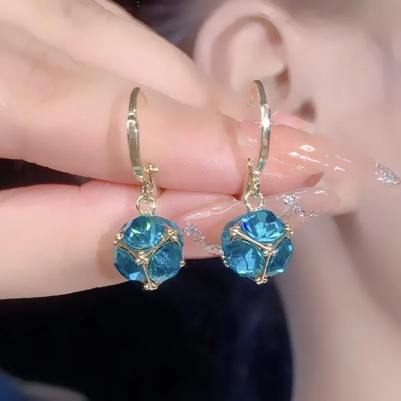 Geometric rose design women's electroplated copper earrings shown in one of the available colour variants.