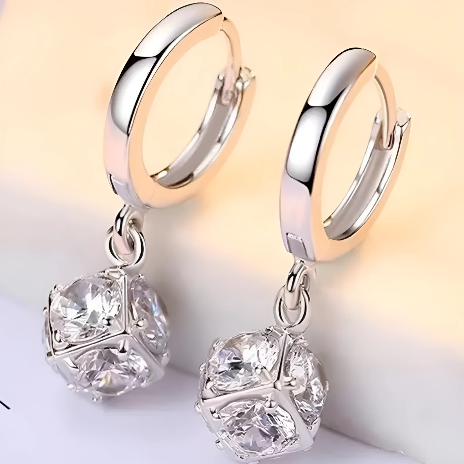 Geometric rose design women's electroplated copper earrings shown in one of the available colour variants.