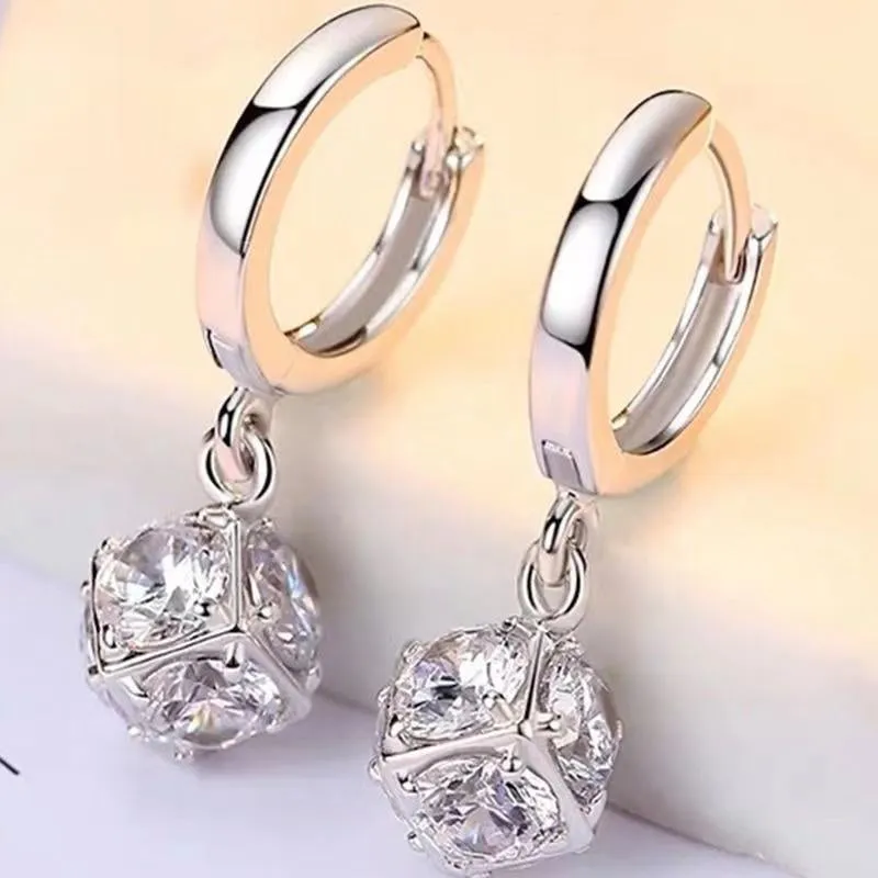 Geometric rose design women's electroplated copper earrings shown in one of the available colour variants.