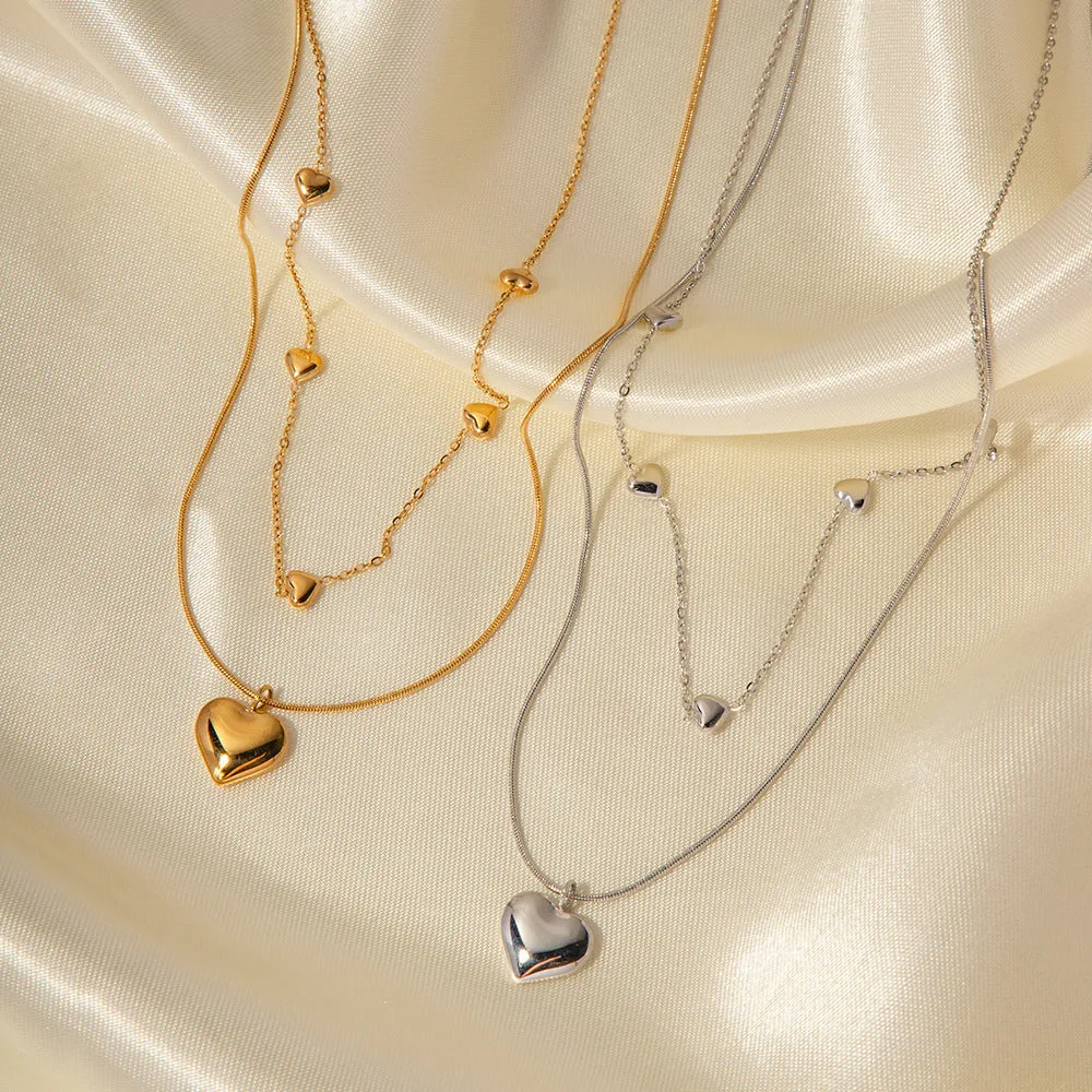 Love double-layer 18K gold-plated collarbone necklace with snake pendant for women on display
