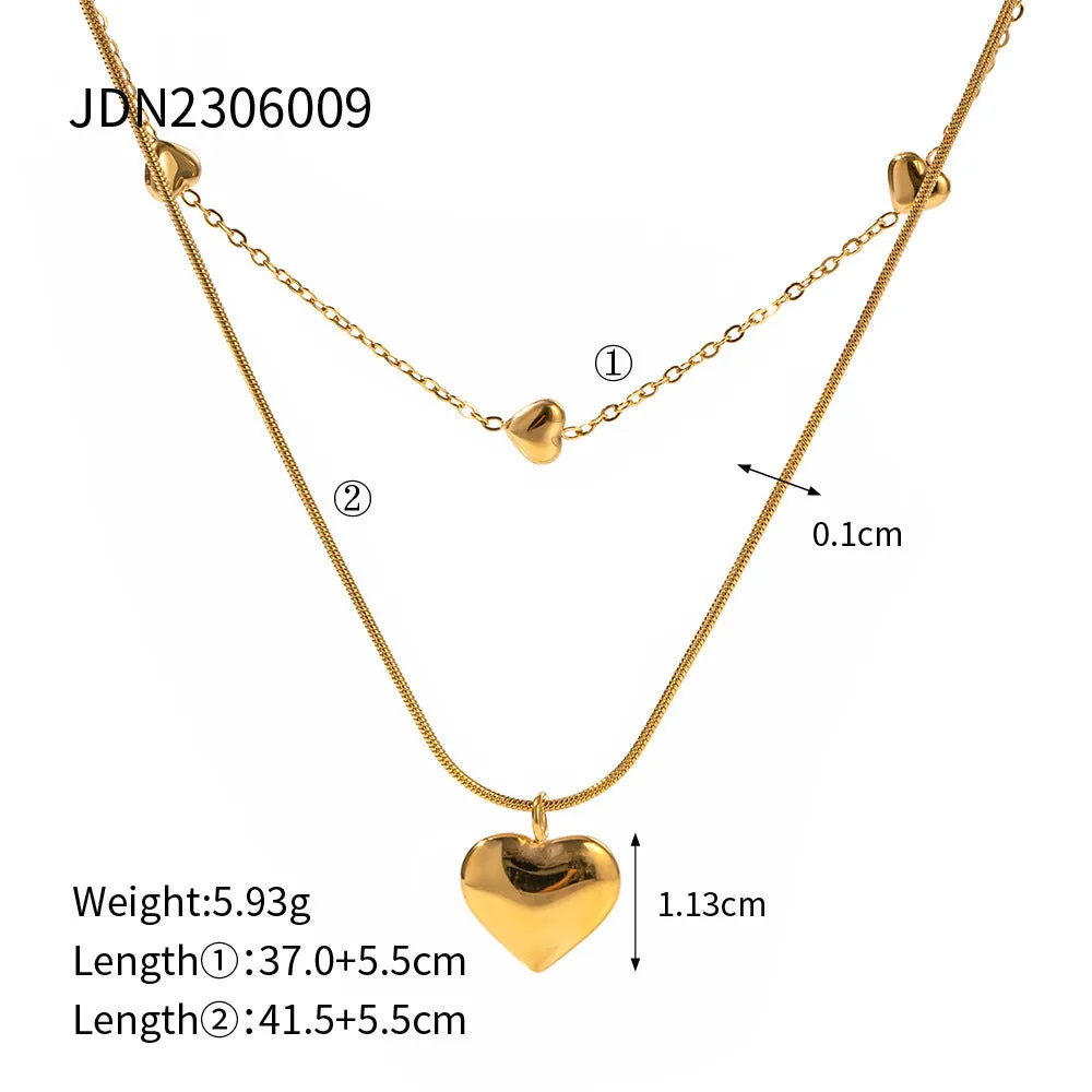 Love double-layer 18K gold-plated collarbone necklace with snake pendant for women on display