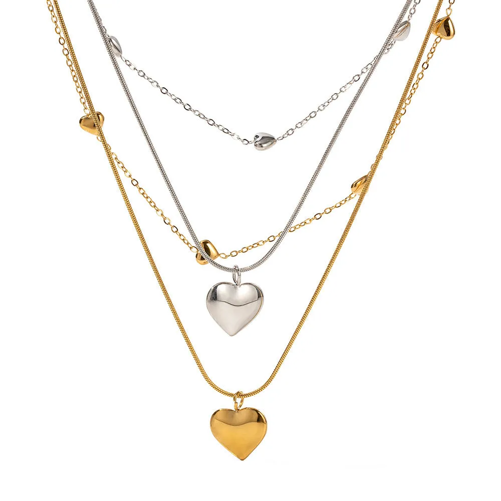 Love double-layer 18K gold-plated collarbone necklace with snake pendant for women on display