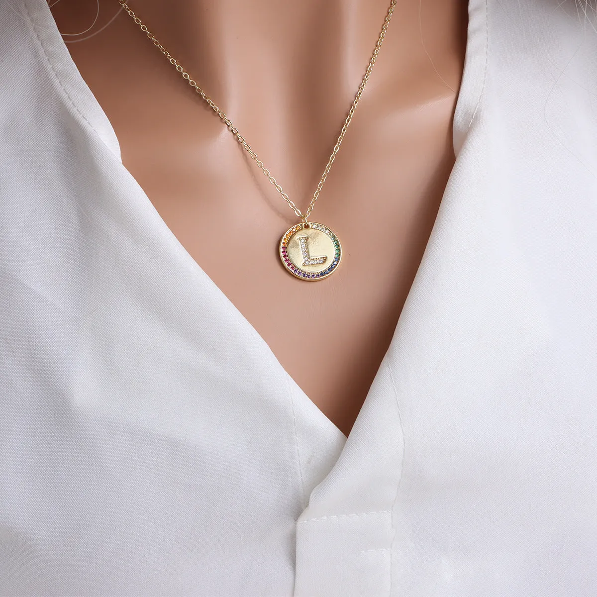 Gold English letter round pendant necklace with colourful crystals on clavicle length chain