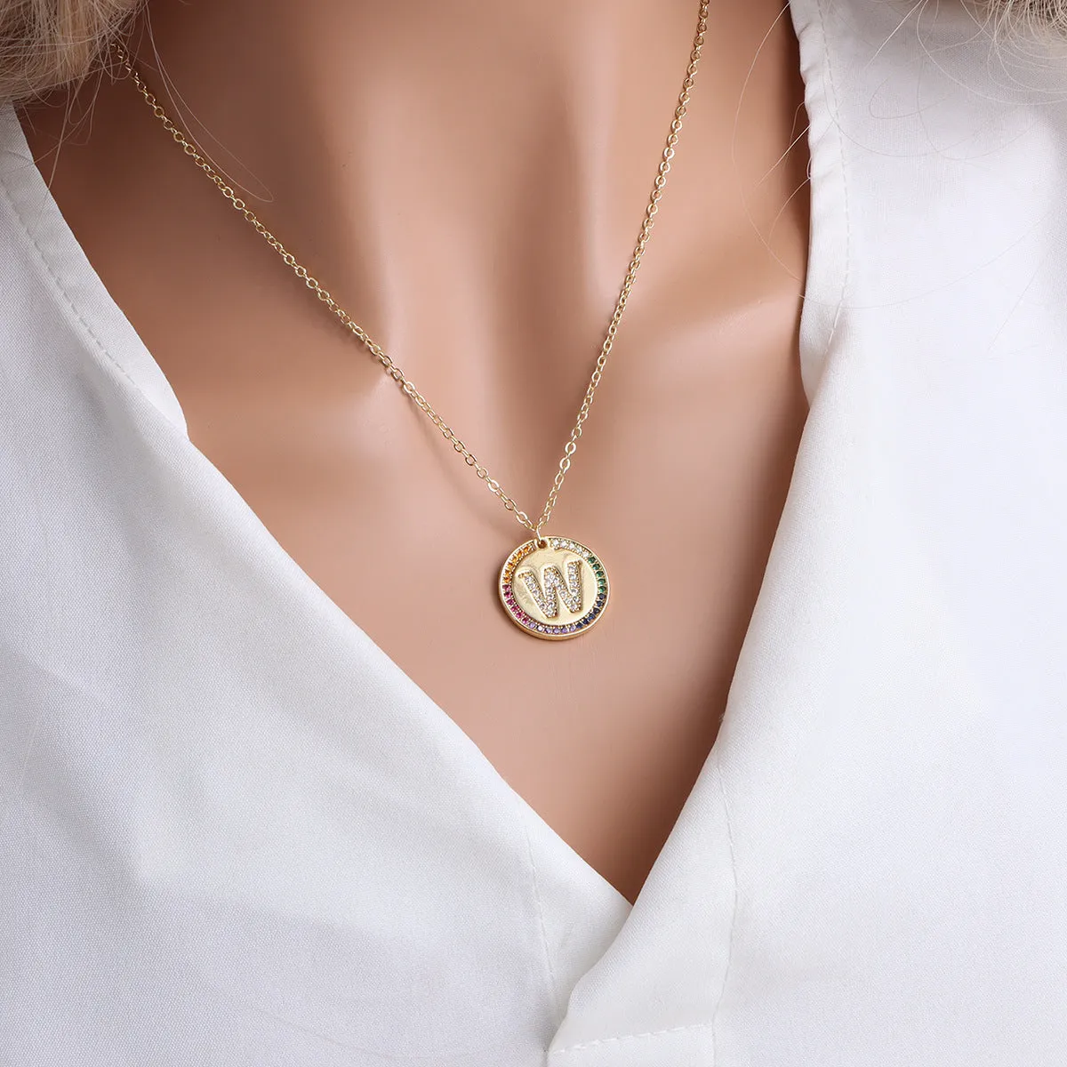 Gold English letter round pendant necklace with colourful crystals on clavicle length chain
