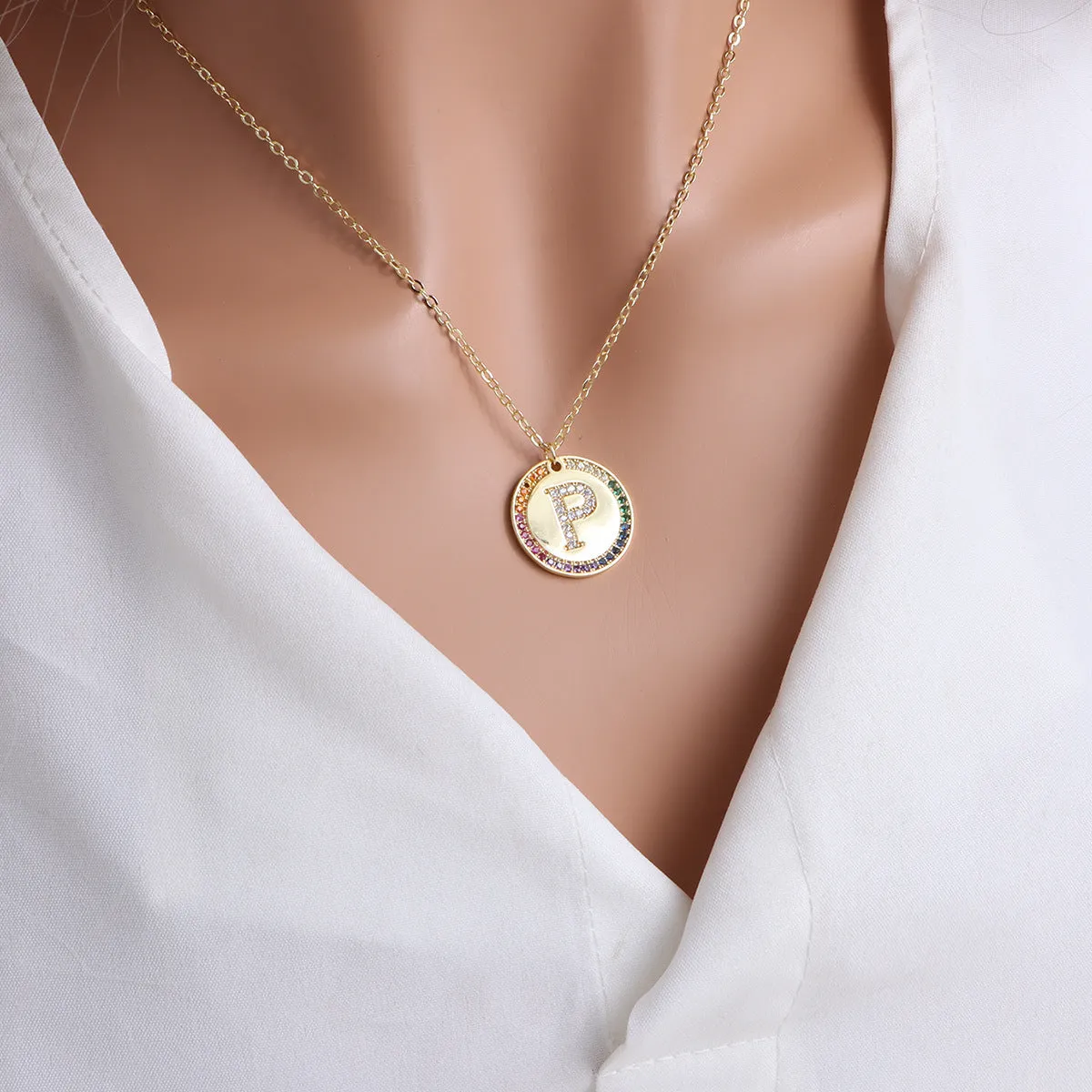 Gold English letter round pendant necklace with colourful crystals on clavicle length chain