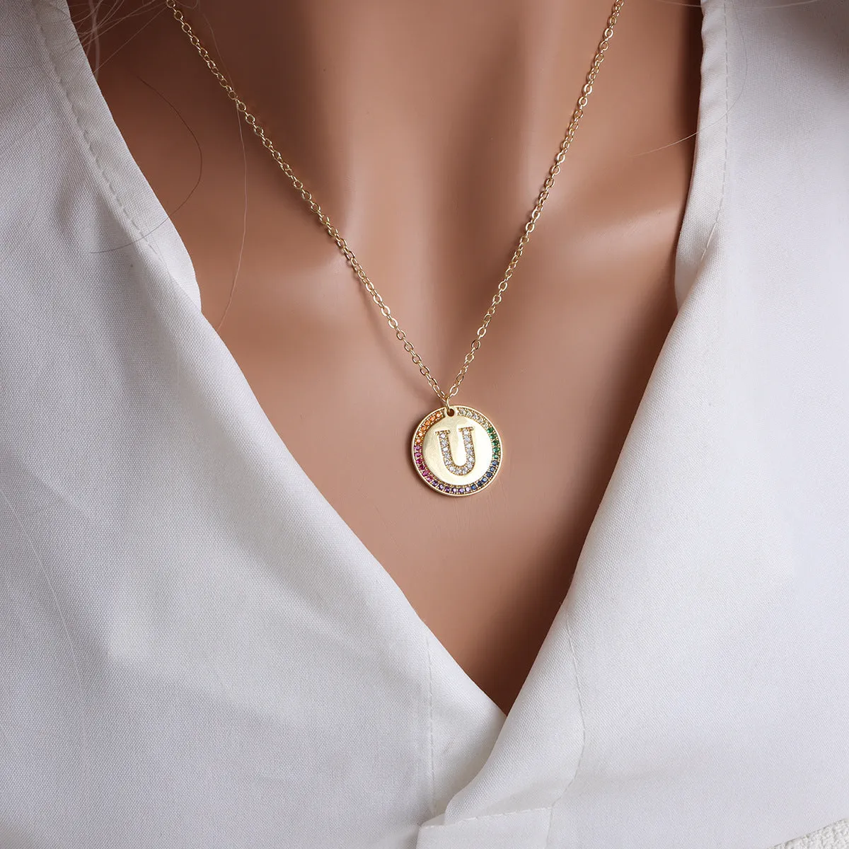 Gold English letter round pendant necklace with colourful crystals on clavicle length chain