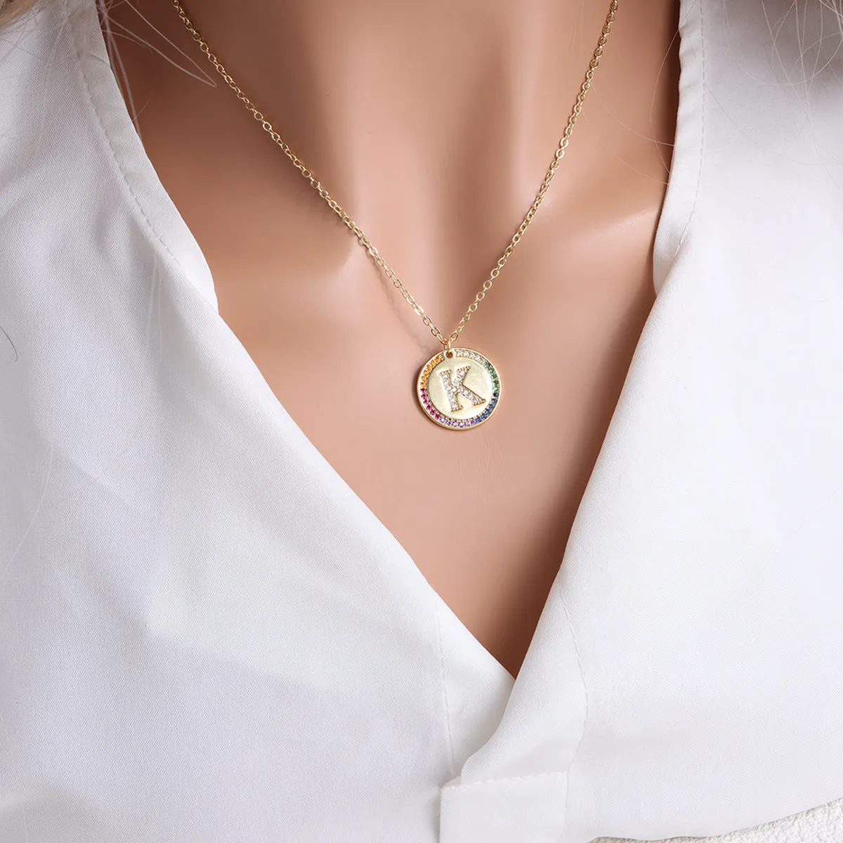 Gold English letter round pendant necklace with colourful crystals on clavicle length chain