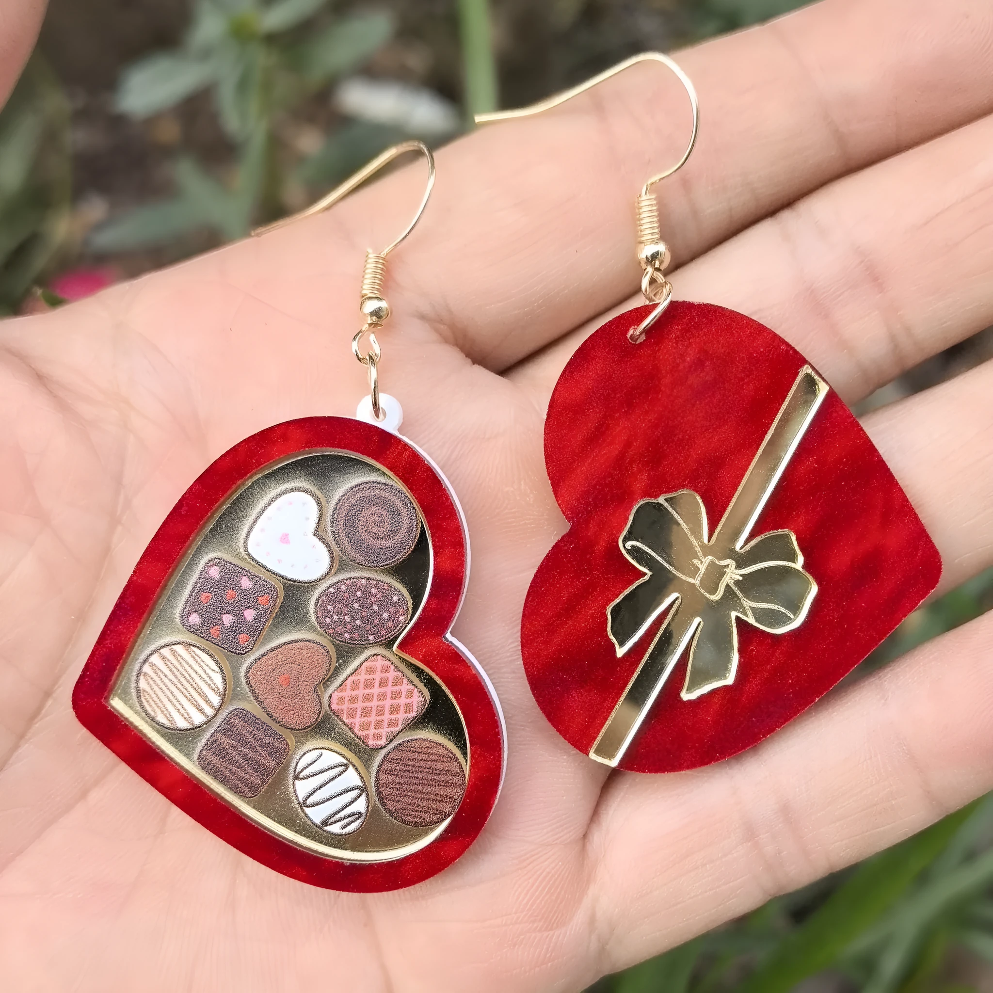 Red gift box containing heart-shaped acrylic drop earrings with ice cream and You Make ME Melt design
