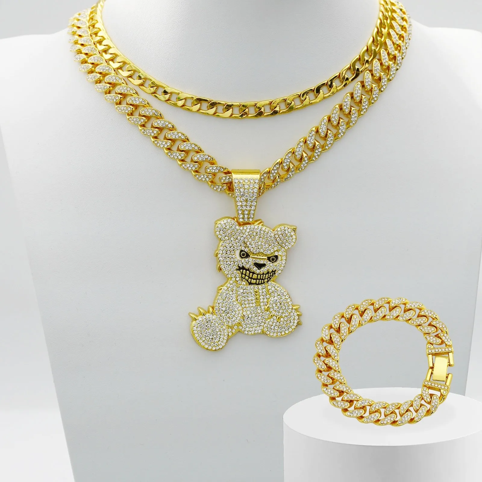 Gold three-piece jewellery set with rhinestone bear pendants on Cuban link chain necklaces and bracelet