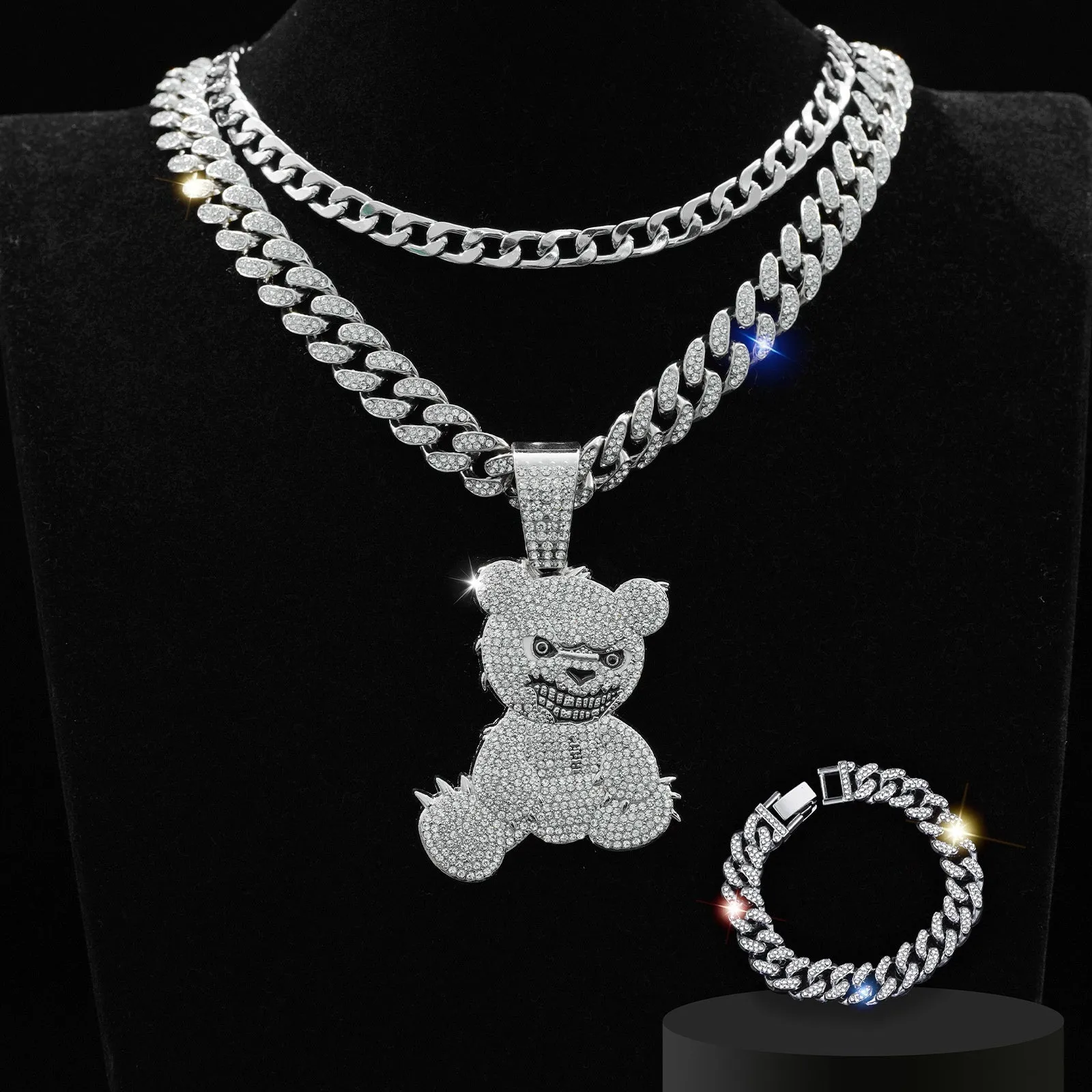 Gold three-piece jewellery set with rhinestone bear pendants on Cuban link chain necklaces and bracelet