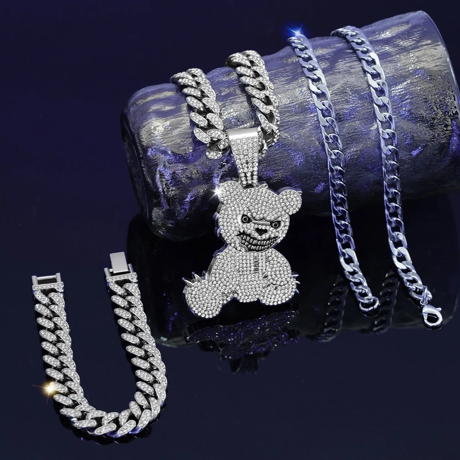 Gold three-piece jewellery set with rhinestone bear pendants on Cuban link chain necklaces and bracelet