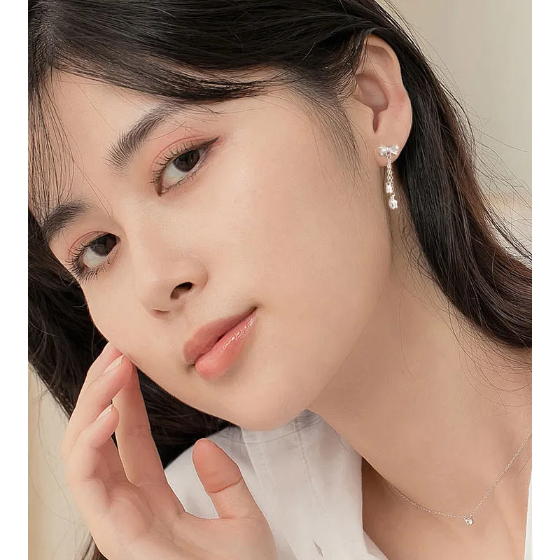 Silver bow eardrops with sweet tassel bone stud design for women