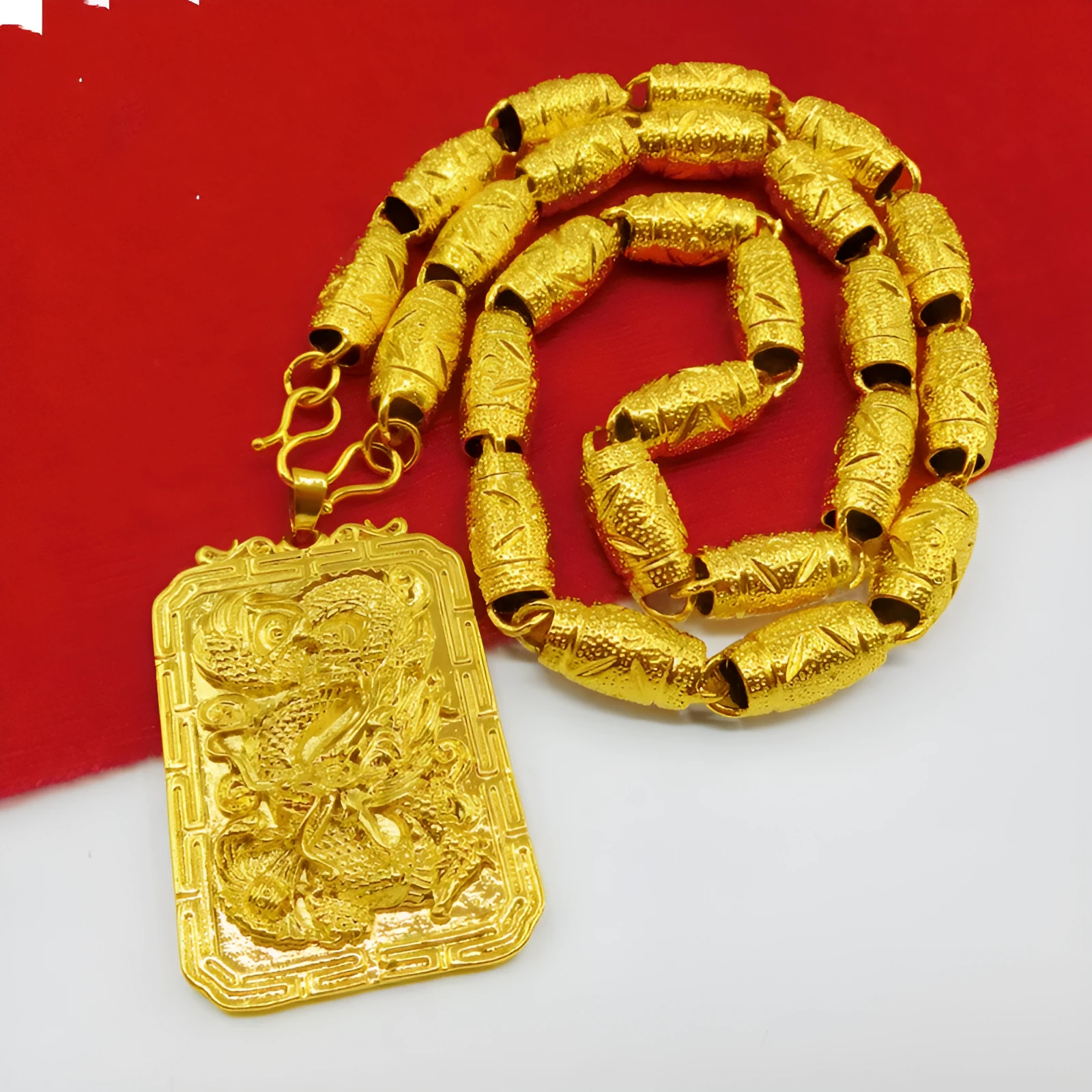 Gold dragon pendant for men, solid 40g metal, animal zodiac style, on display
