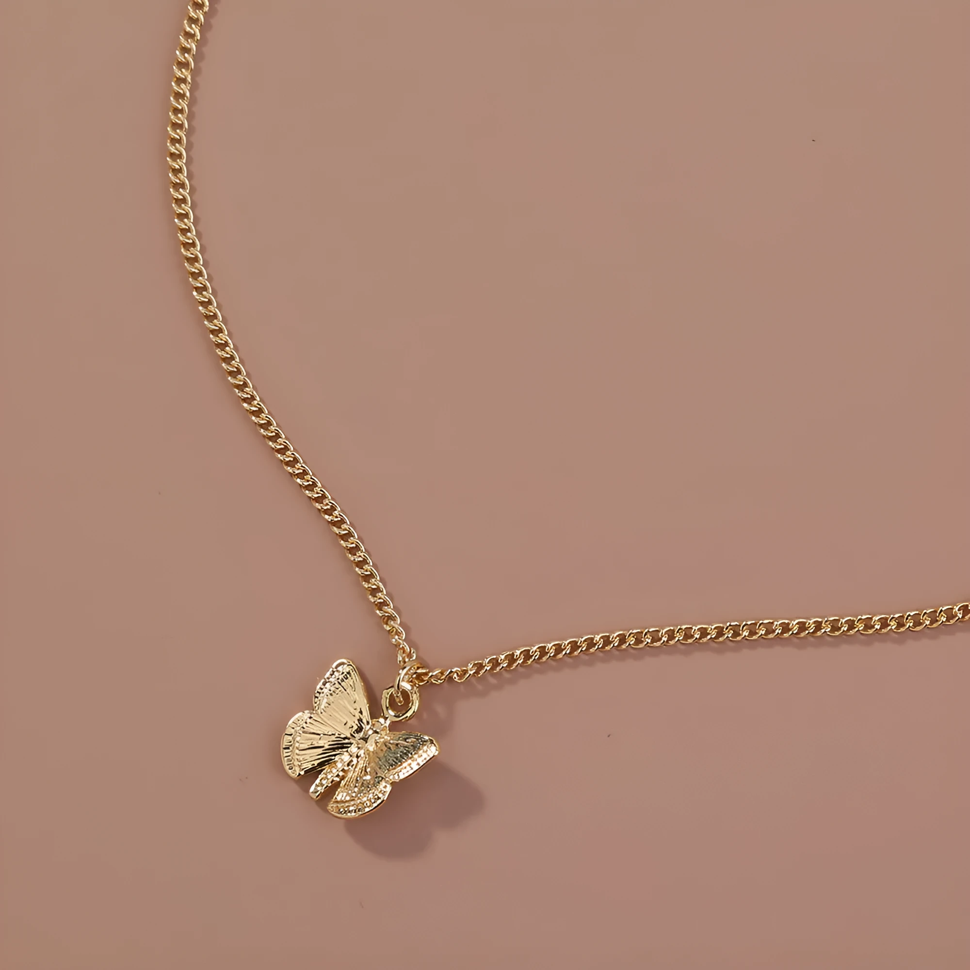 Gold-tone butterfly pendant necklace on a 45cm chain with zinc alloy and electroplate finish