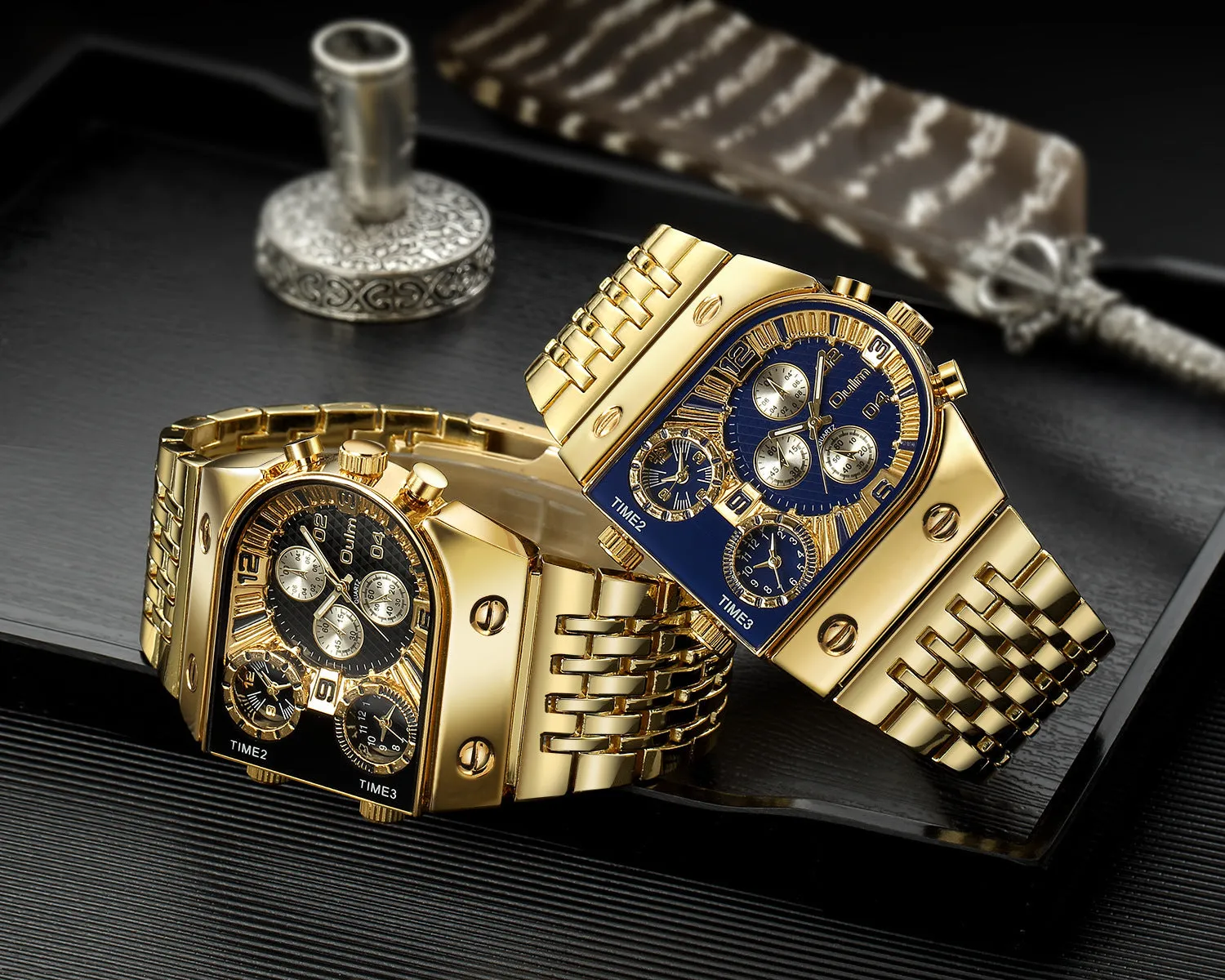 Luminous men's gold-tone watch with steel band and white multifunction dial against grey background