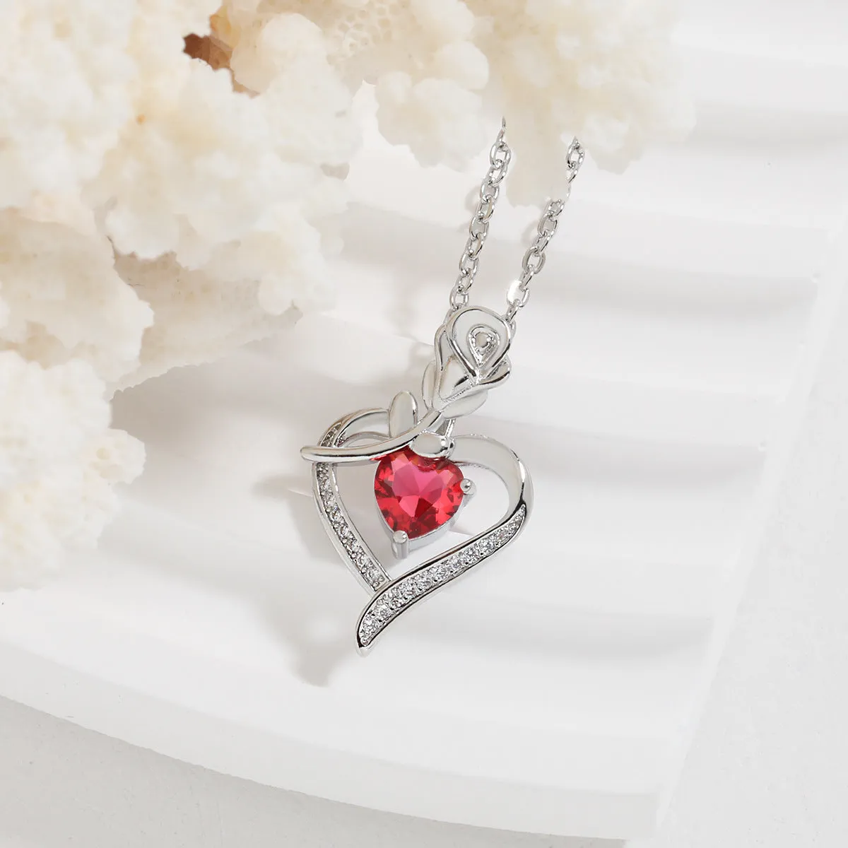 Rose heart-shaped necklace with rhinestones in copper electroplated finish, available in blue, purple, red, or white