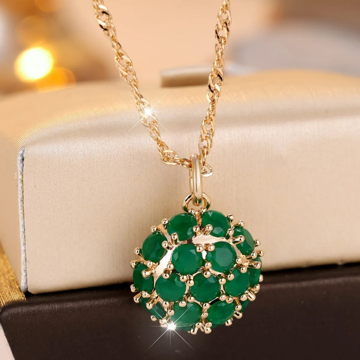 Champagne gold emerald diamond necklace with geometric pendant on adjustable chain