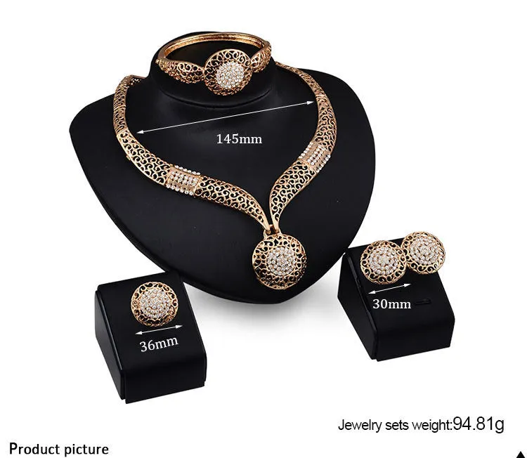 Gold jewellery four piece set with necklace, earrings, ring, and hand accessories featuring alloy and artificial gems