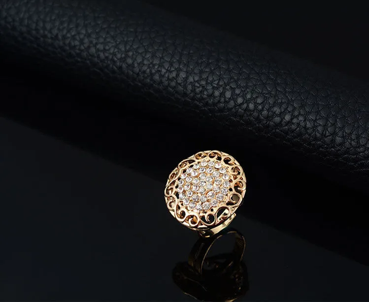Gold jewellery four piece set with necklace, earrings, ring, and hand accessories featuring alloy and artificial gems