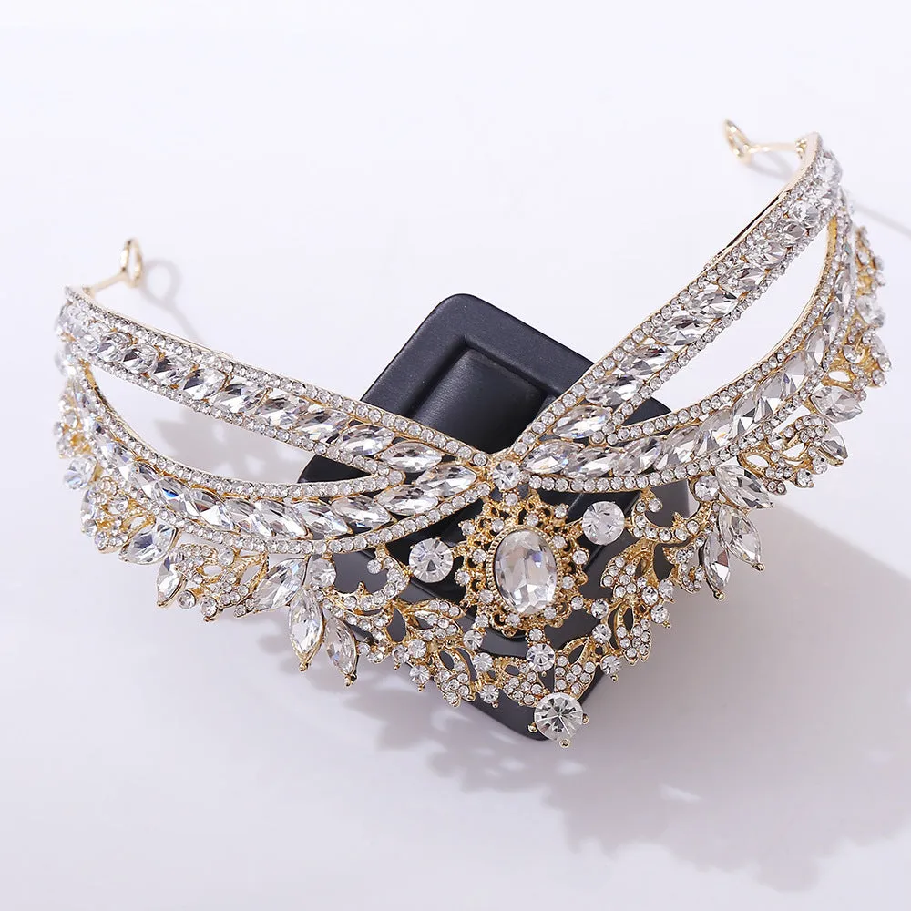 Wedding crown headdress with rhinestone and crystal in silver white finish on display