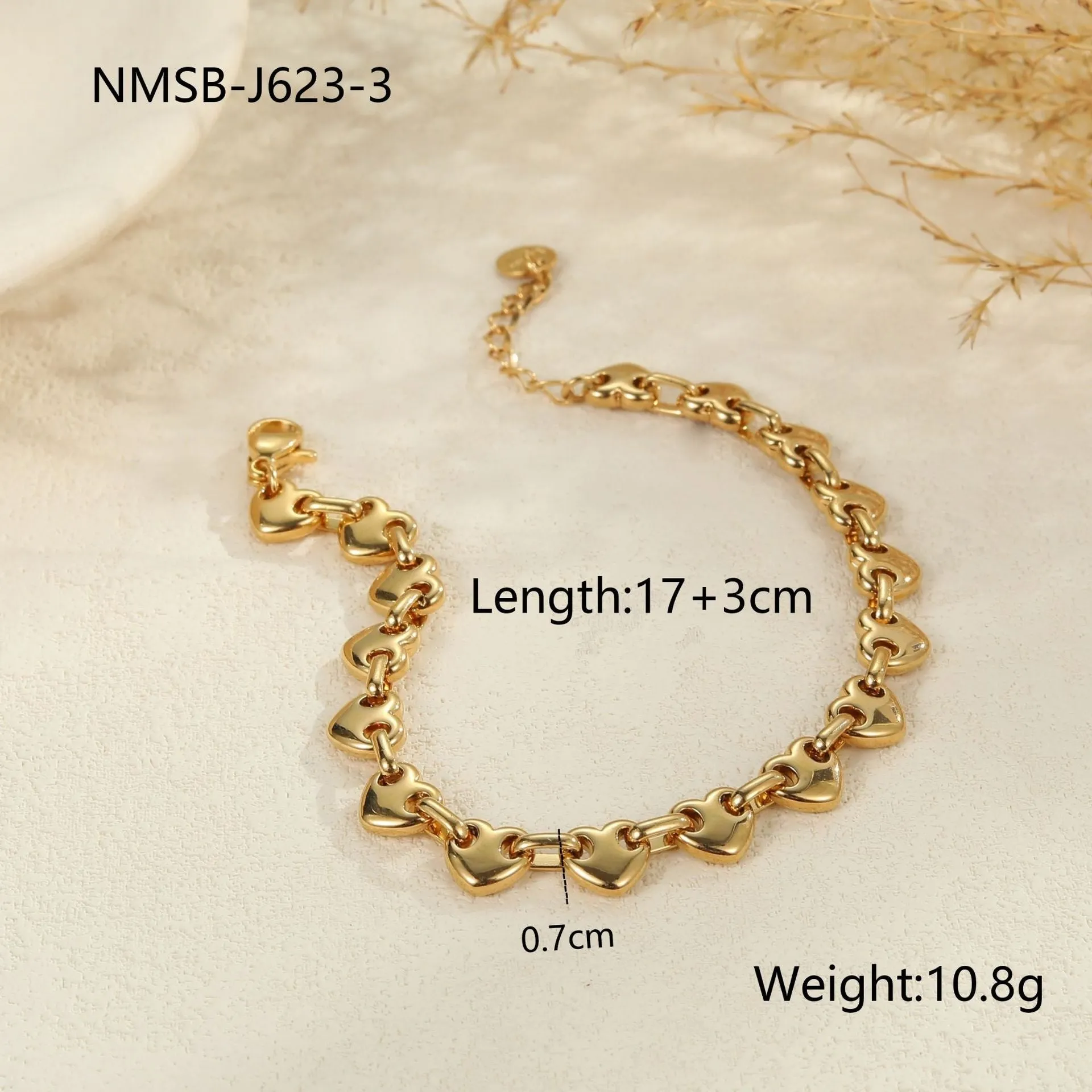Stainless steel women's bracelet with a hollowed-out heart design in gold, steel, or colour-blocked finish.