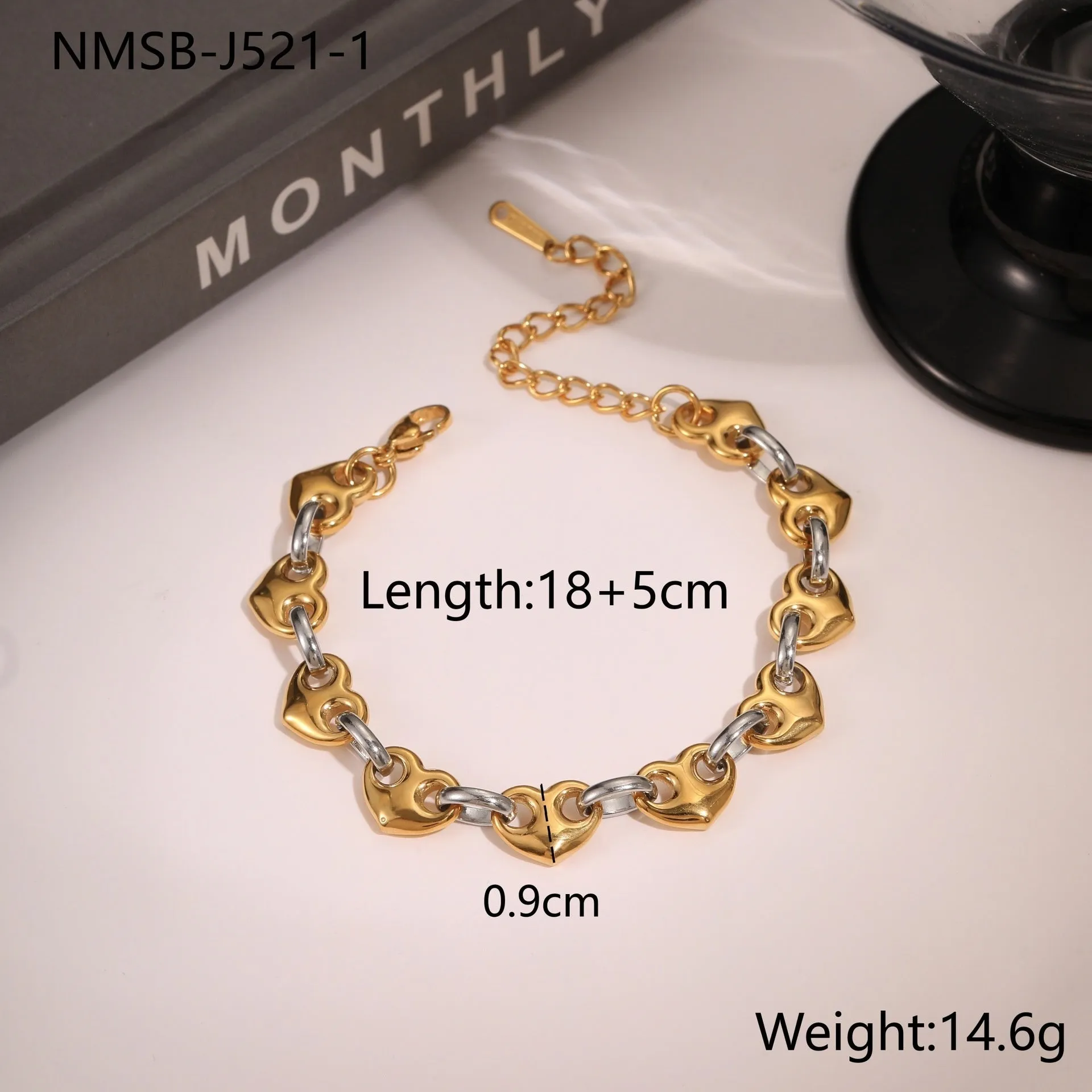 Stainless steel women's bracelet with a hollowed-out heart design in gold, steel, or colour-blocked finish.