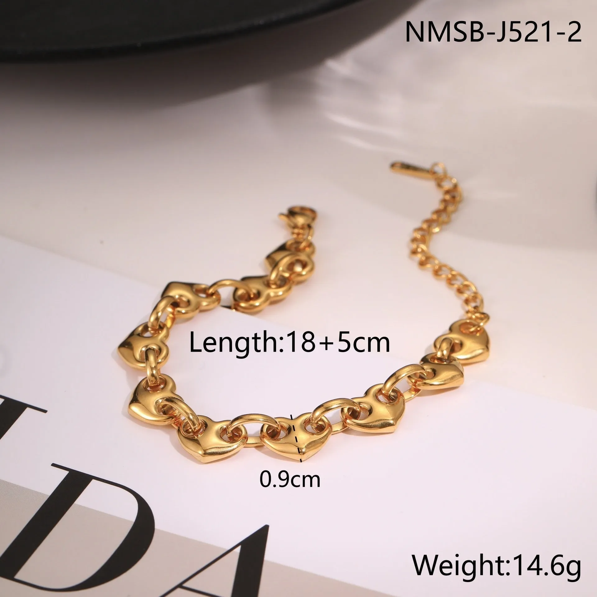 Stainless steel women's bracelet with a hollowed-out heart design in gold, steel, or colour-blocked finish.