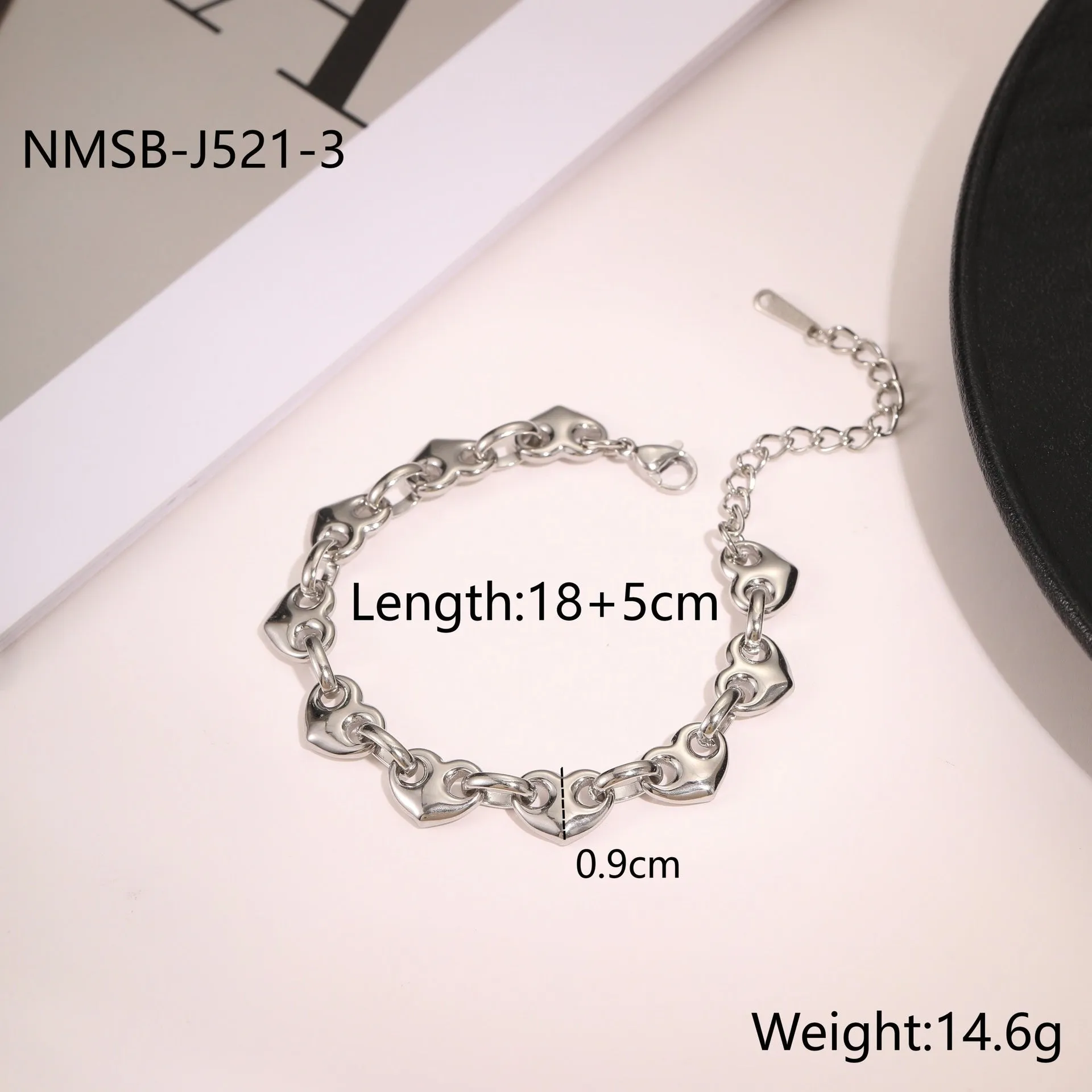 Stainless steel women's bracelet with a hollowed-out heart design in gold, steel, or colour-blocked finish.
