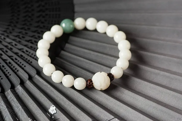 Natural white jade Bodhi bracelet with round beads and transfer bead on white background