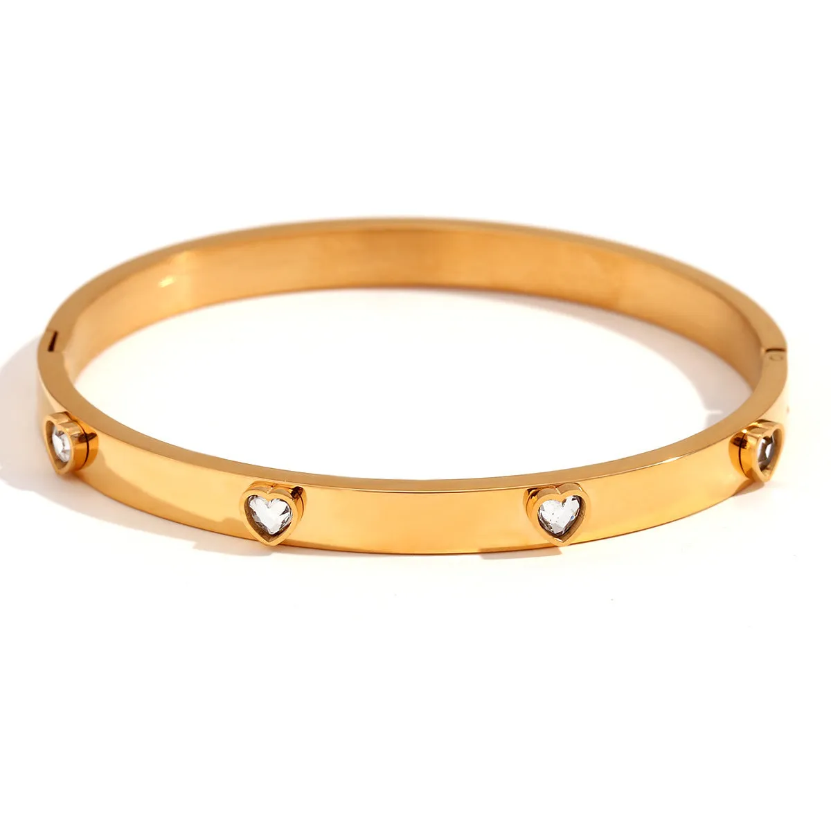 Gold electroplated stainless steel bracelet with micro-inlaid peach heart design and diamond accents