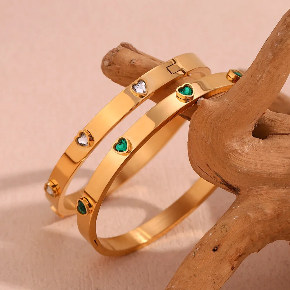 Gold electroplated stainless steel bracelet with micro-inlaid peach heart design and diamond accents