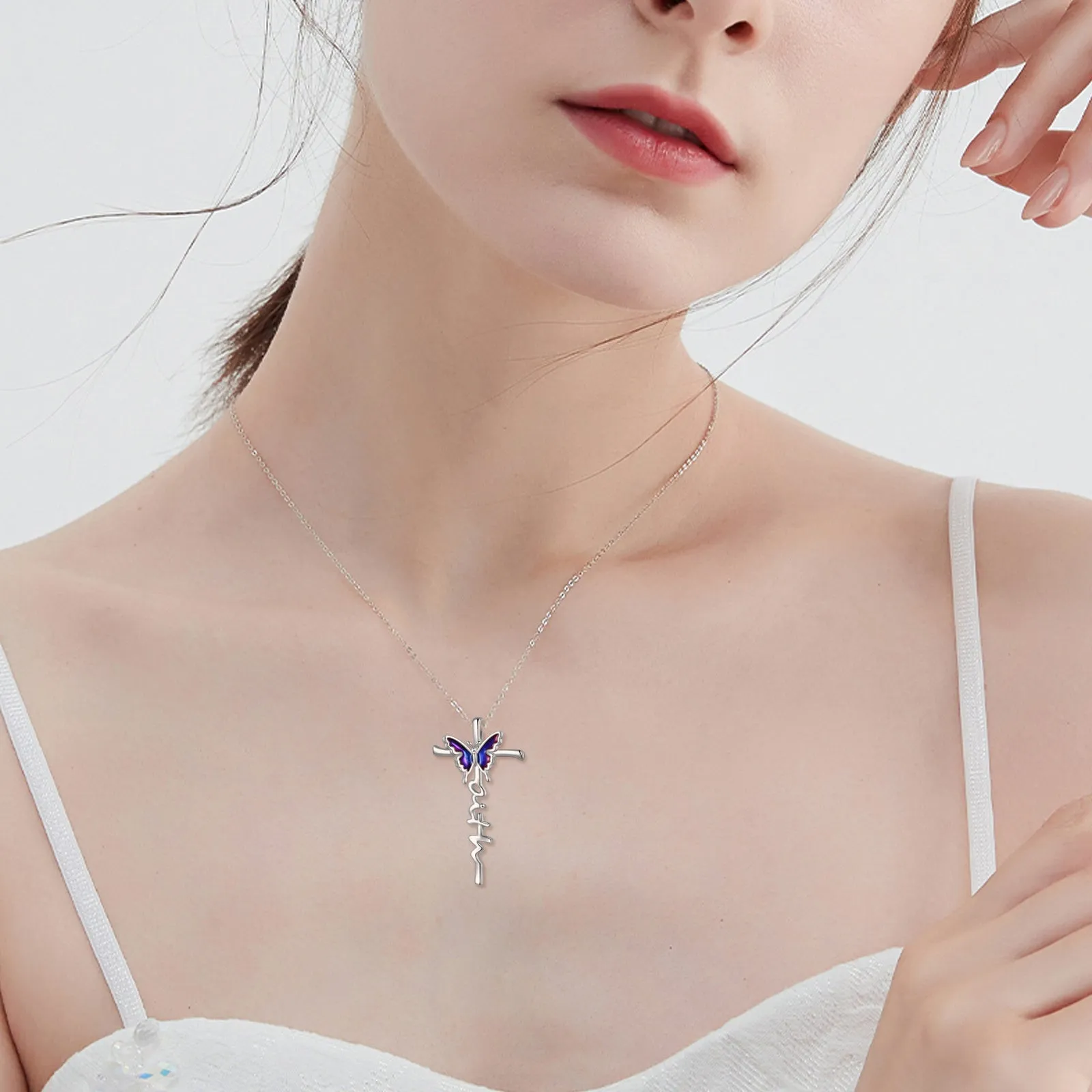 Sterling silver butterfly cross pendant necklace on white gold plated cable chain