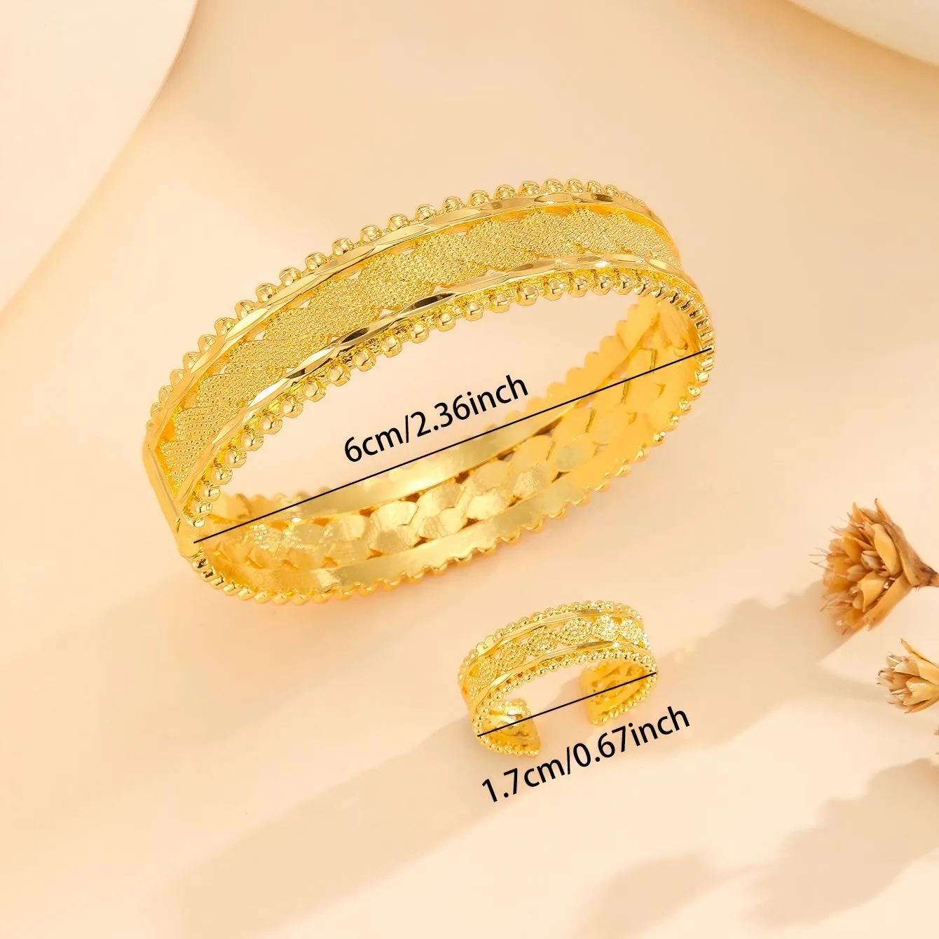 2pcs vintage gold plated bracelet and ring set with floral design and bead edges on a white background