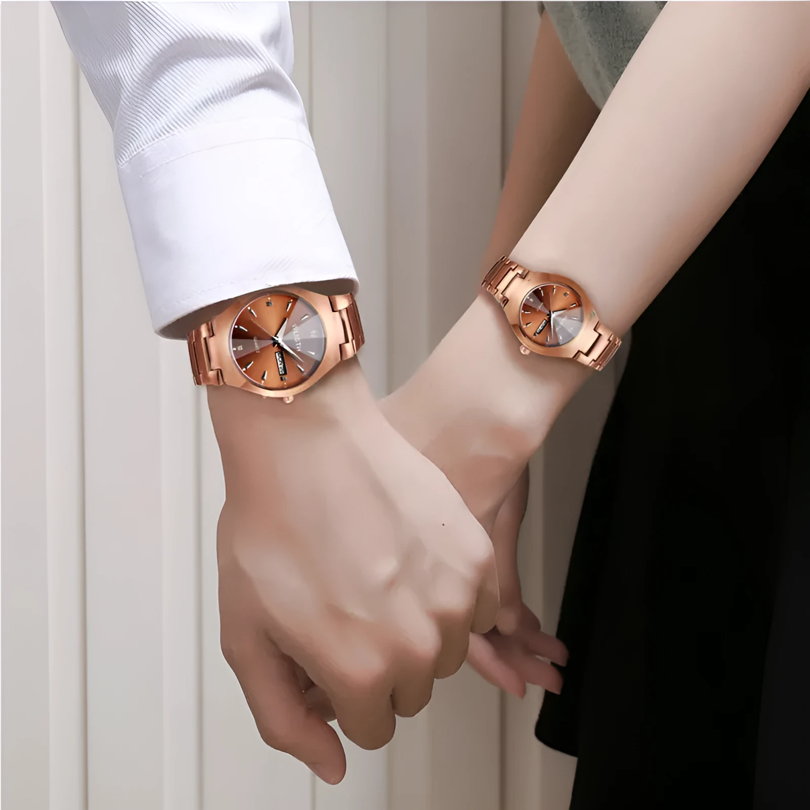 Coffee gold luminous couple watch with alloy strap and mineral glass dial displayed on light background